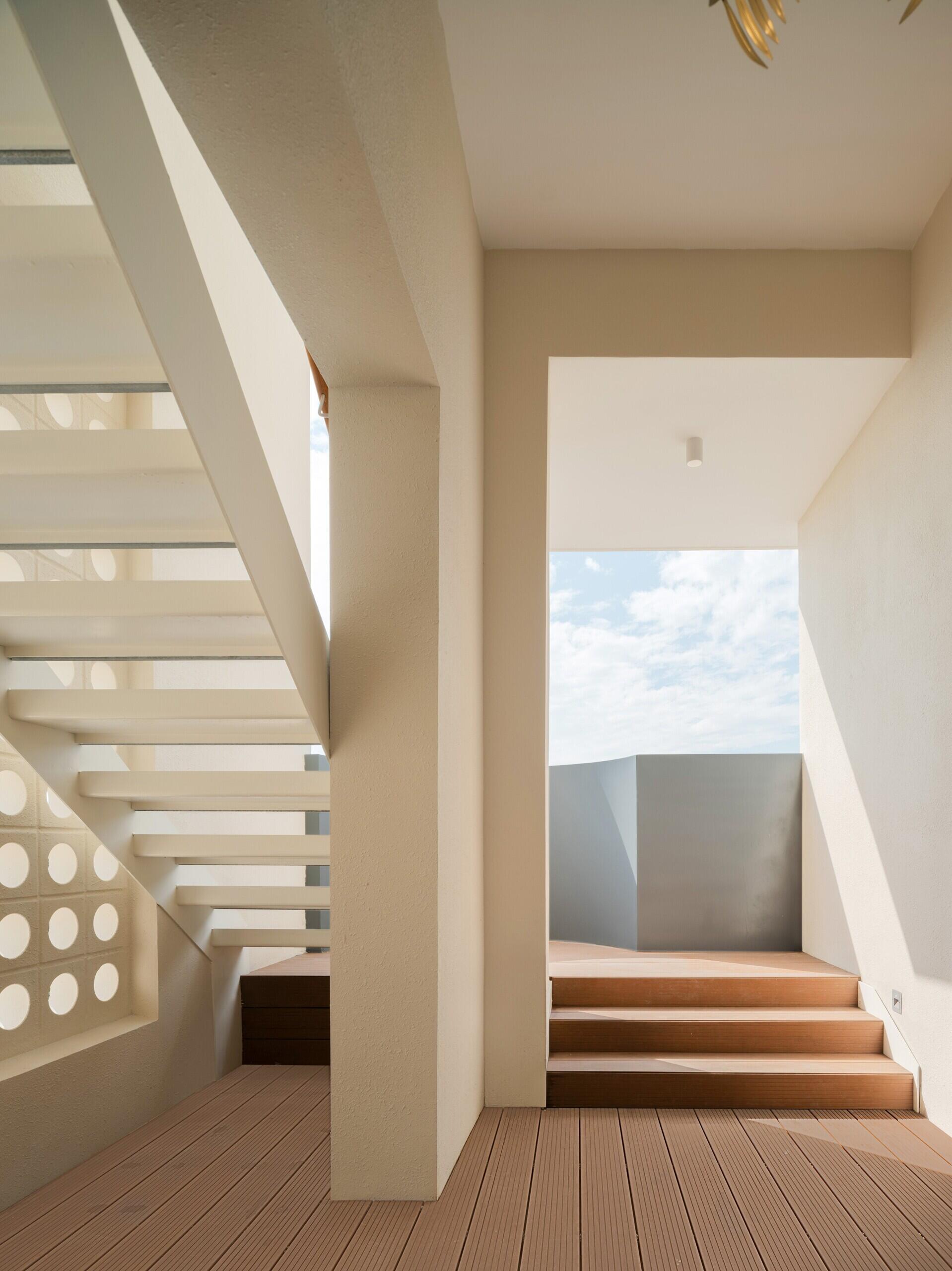 A modern house with exterior stairs.