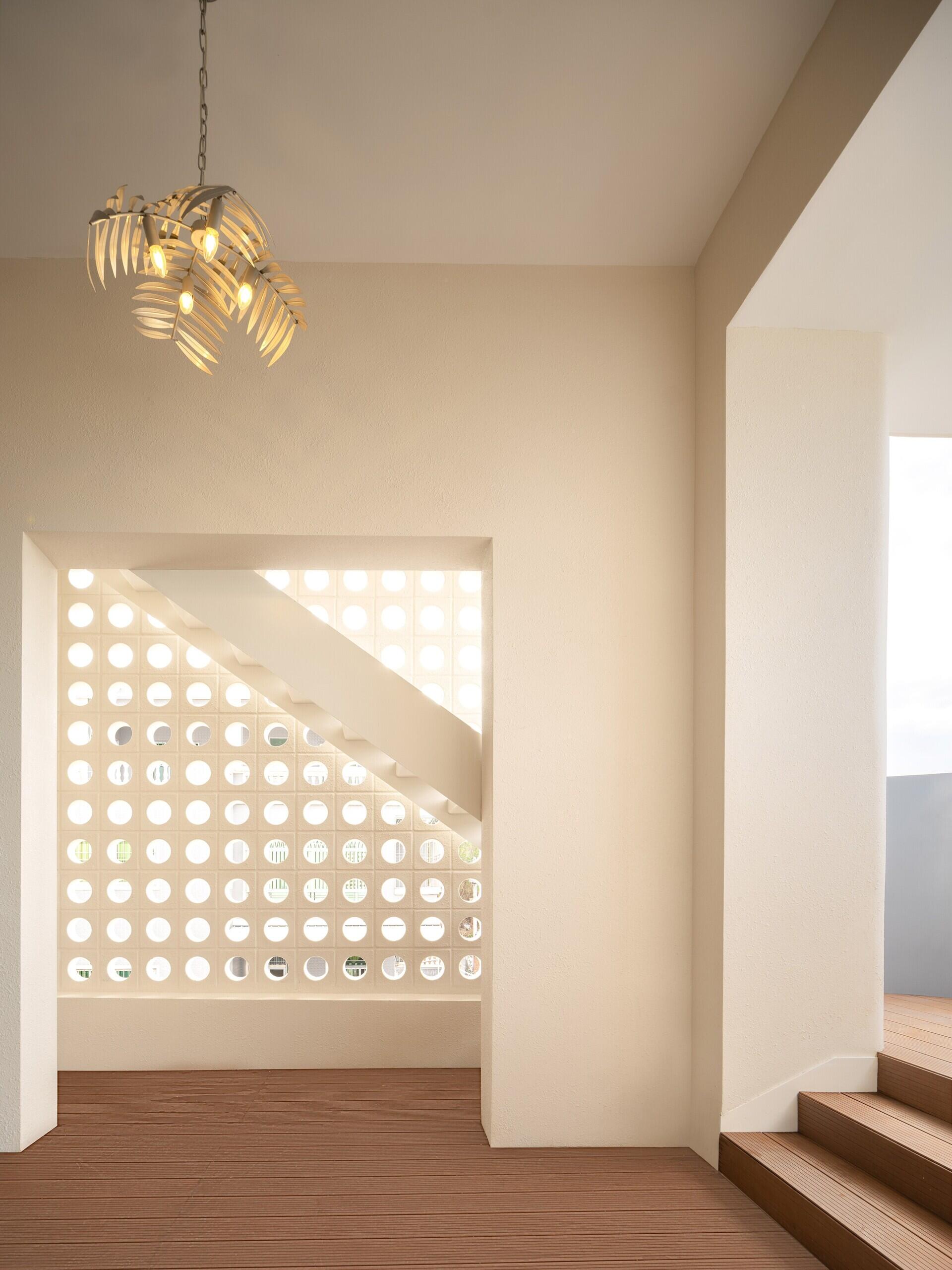 A modern house with exterior stairs.