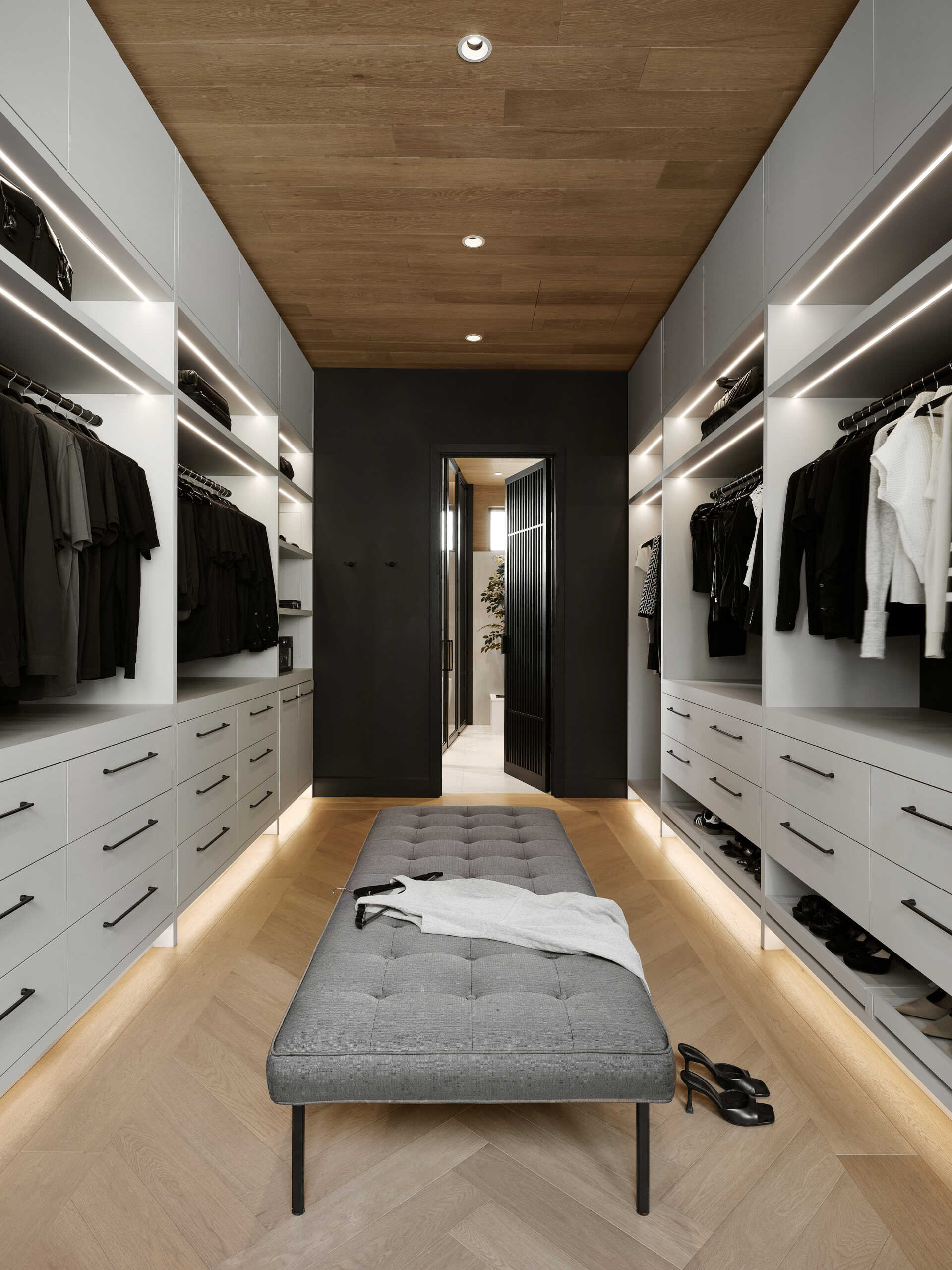 Custom-designed walk-in closets continue the project’s tailored approach to interior design. Integrated storage solutions keep the spaces highly functional while maintaining the clean visual language seen throughout the residence. Built-in lighting adds warmth and depth, transforming storage into an extension of the architecture itself.