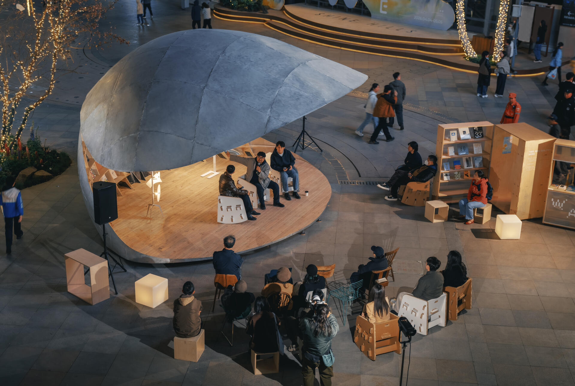 A shell-inspired pavilion in Beijing by LUO Studio opens and closes to create a flexible public space for reading, gathering, and events, bringing movement and interaction into the heart of a busy plaza.