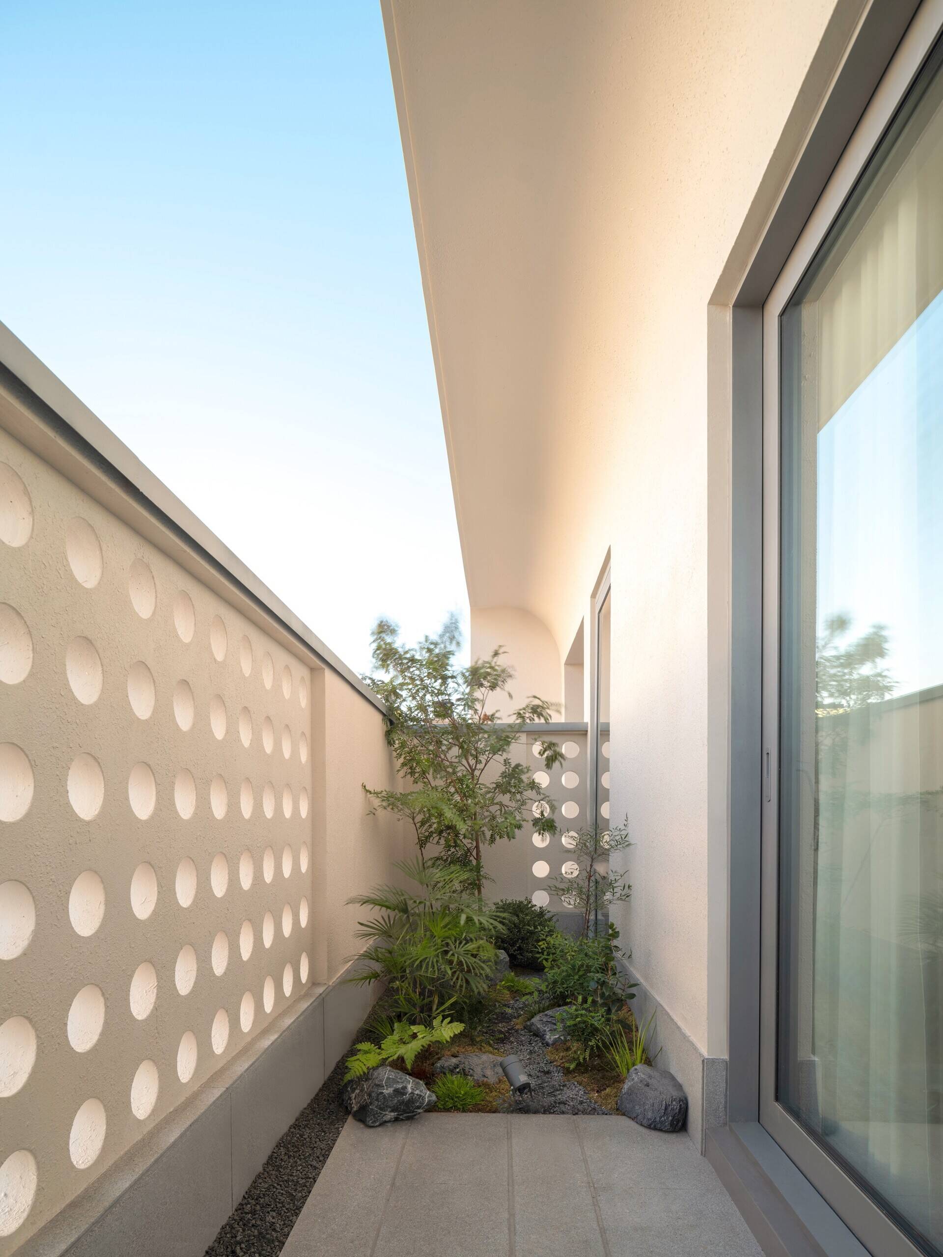 A modern house with a small patio.