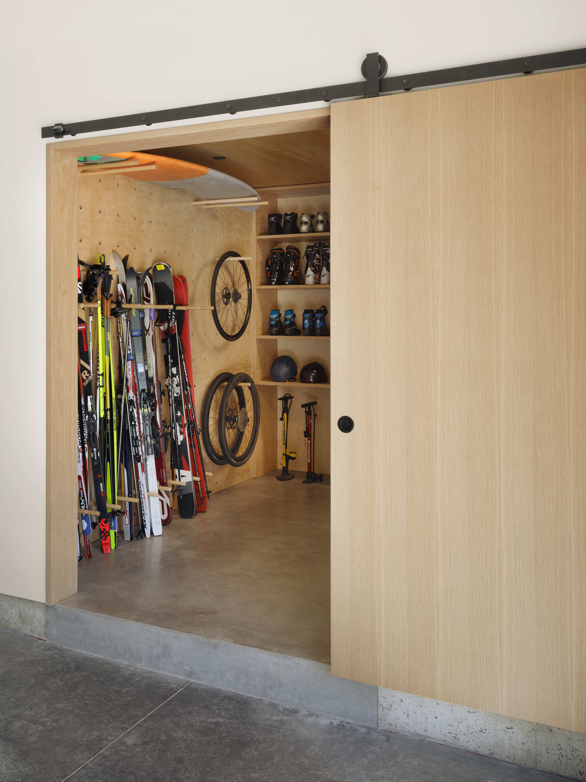 Even the storage spaces in this modern Oregon home feature clean lines, integrated organization, and minimalist detailing.