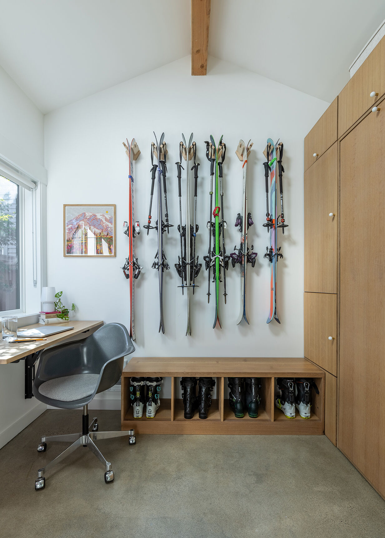 A fold-down desk transforms this compact studio from home office to guest suite in seconds, proving that small spaces can still be incredibly versatile.
