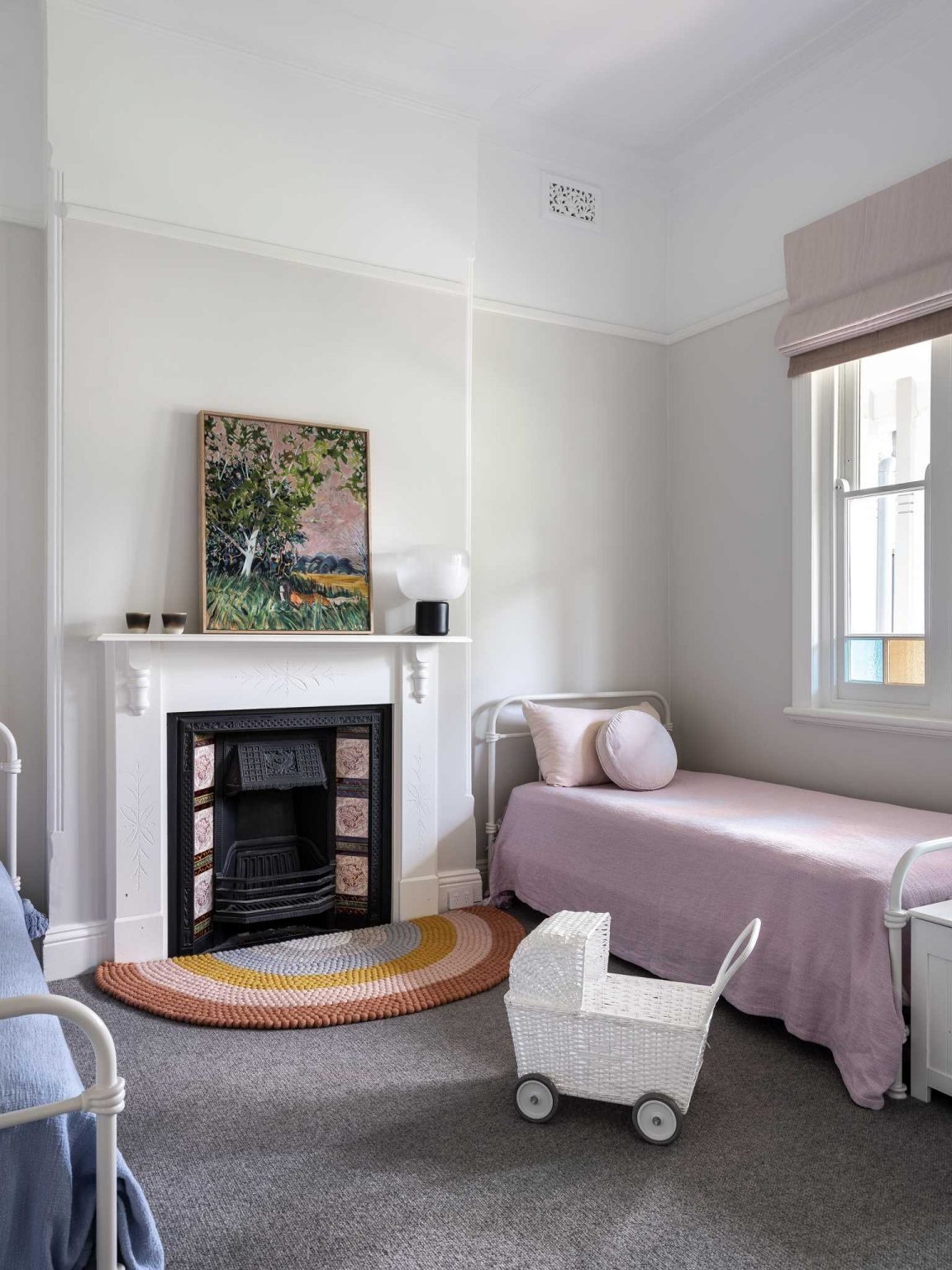 Contemporary bedrooms pair soft finishes with preserved original features that celebrate the home's history.