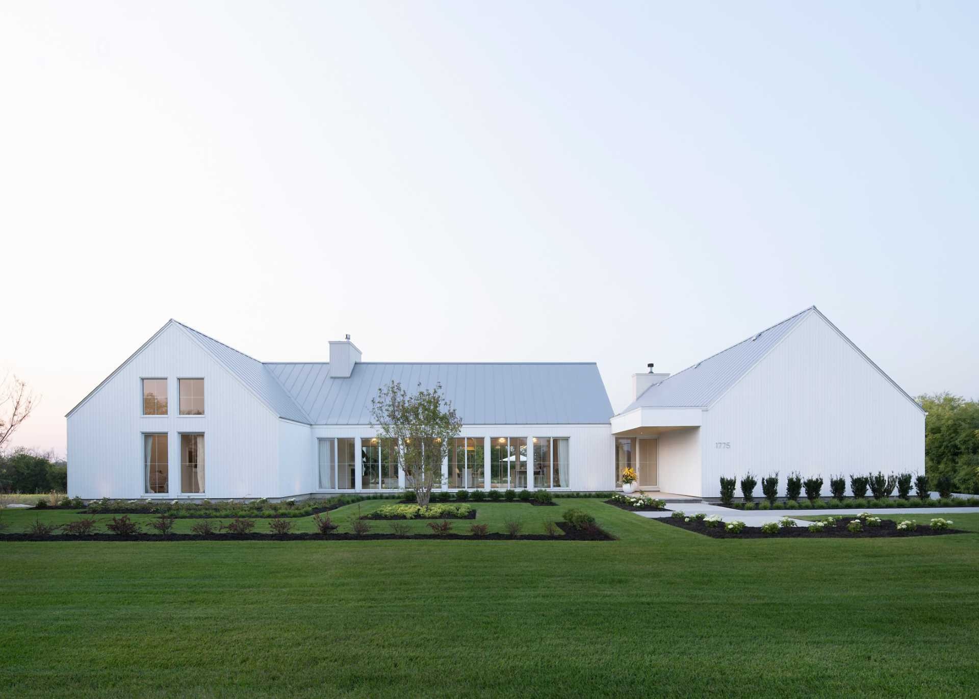 See how DKA divided this Quebec family home into three simple volumes that maximise natural light, improve circulation, and create varied interior spaces.