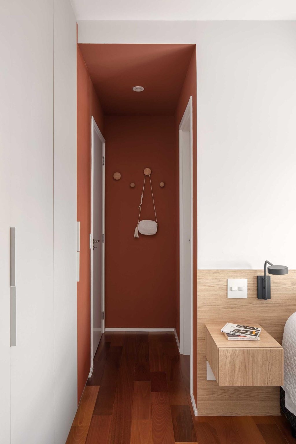 A hallway leads from the public areas of the apartment to the more private family spaces.