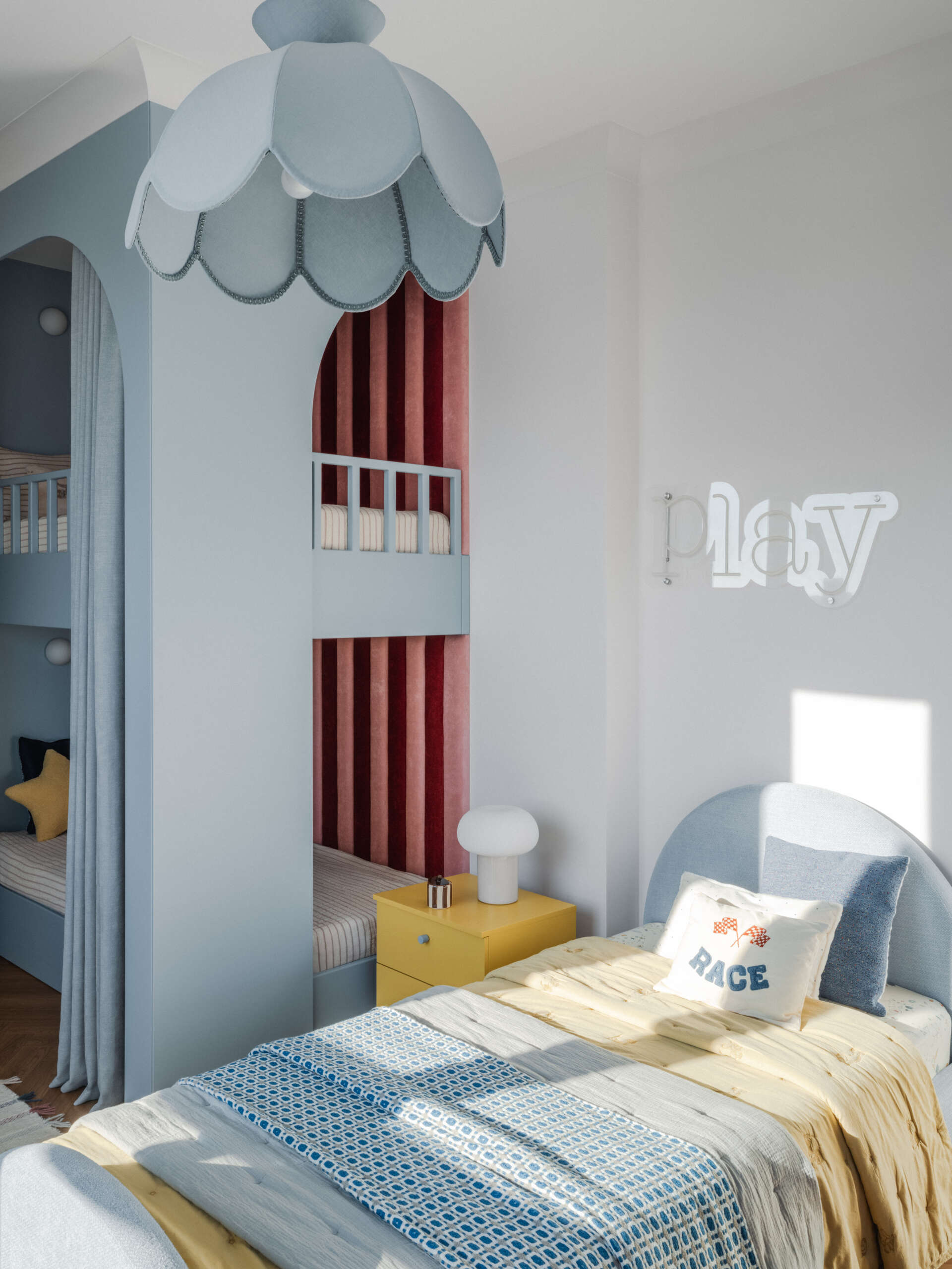 In this children's bedroom for three, colorful yellow cabinets with fun detailing line the wall and at the same time complement the built-in desk underneath the window. Nearby a single bed and a bunk bed provides plenty of space for the children to each have their own area.