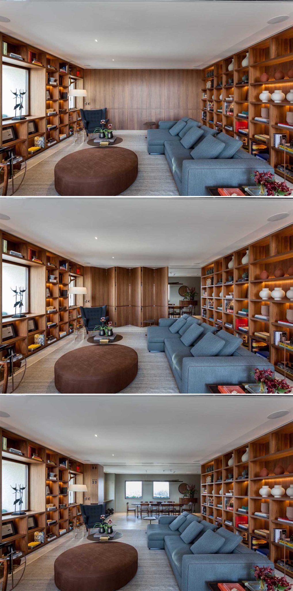 The dining room can be separated using a folding wood partition, allowing the spaces to shift between intimate family use and larger gatherings. A second wall lined with shelving sits behind the main seating area, providing additional display space for books, artwork, and personal collections.