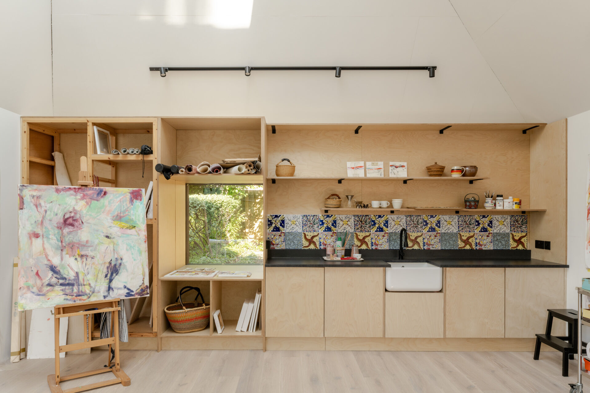 Hidden within a garden near Salisbury, this art studio features charred timber cladding, high-performance SIP construction, natural daylight, and low-impact foundations.