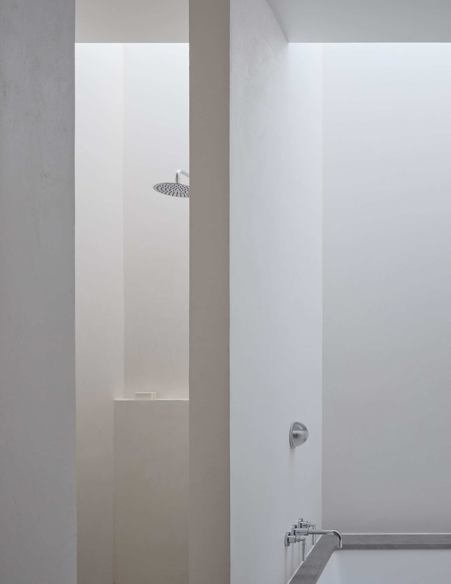 A built-in bathtub and walk-in shower bring comfort and simplicity to this bright upstairs bathroom.