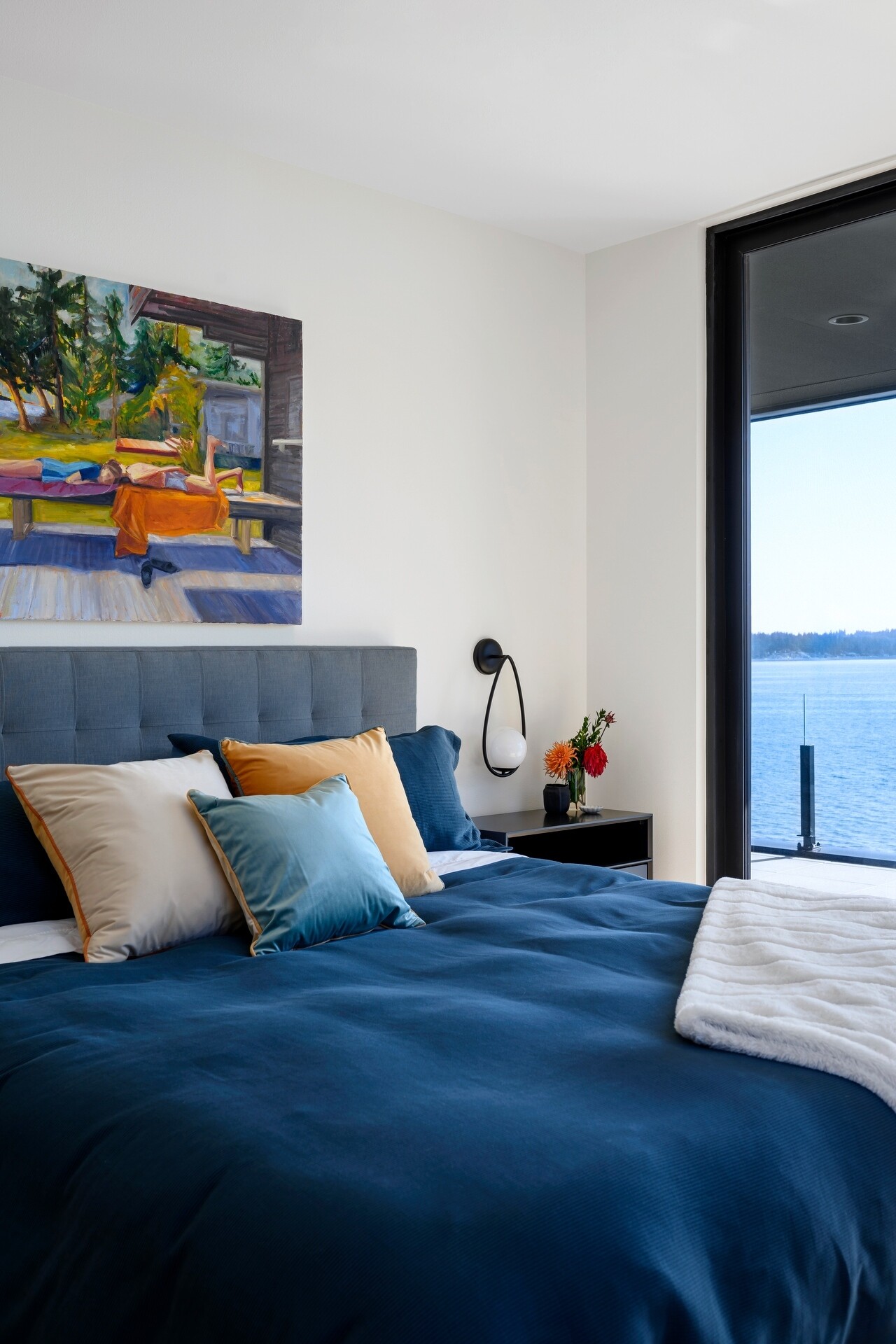 Explore the tranquil bedrooms at Lantern House, where soft textures, warm timber details, and stunning Puget Sound views create inviting spaces to unwind.