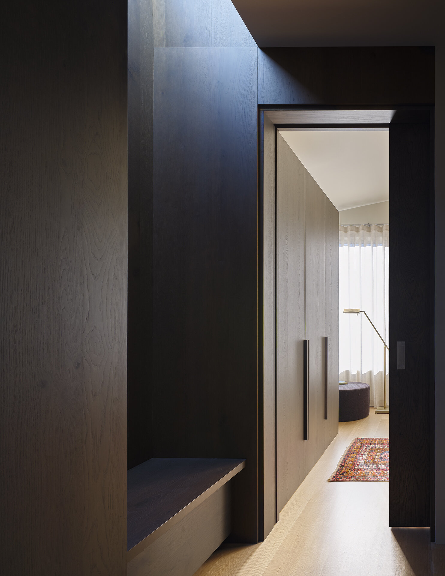 A built-in bench at the top of the stairs adds functionality while making smart use of space.