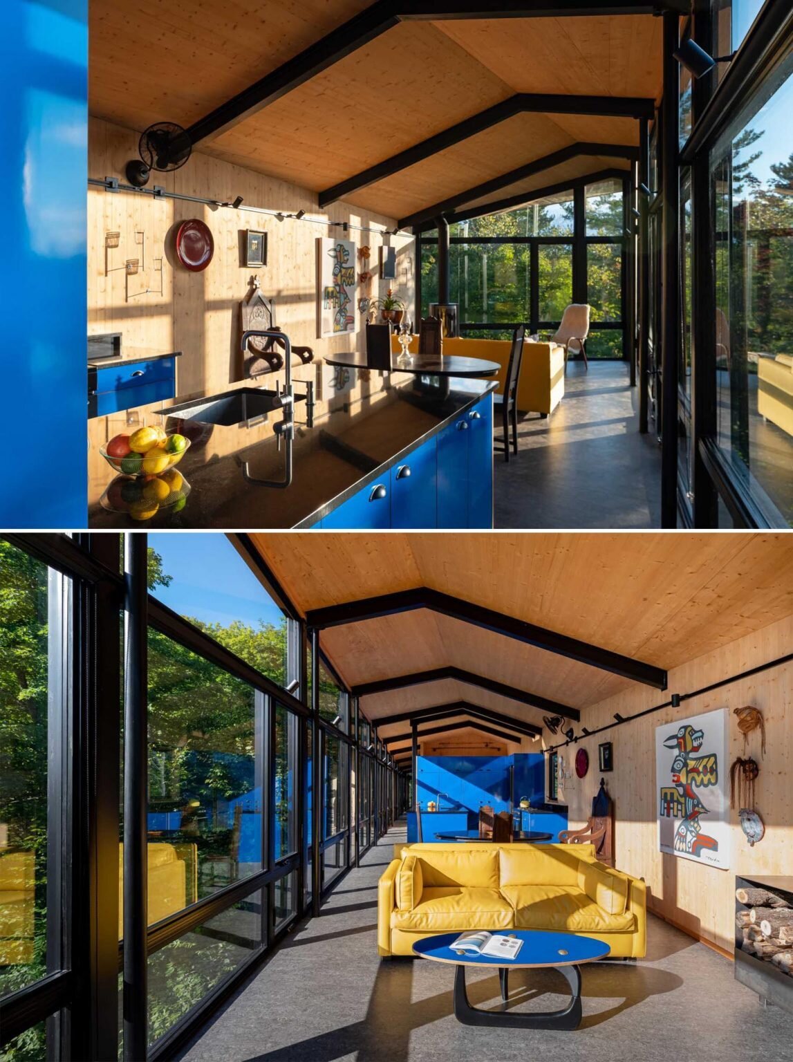 A vibrant blue kitchen creates a bold focal point inside this timber-lined cabin surrounded by forest views.
