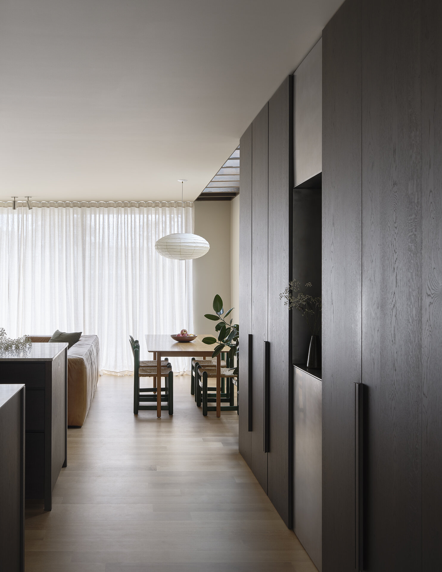 Skylights flood this dining area with soft daylight, creating an ever-changing atmosphere throughout the year.