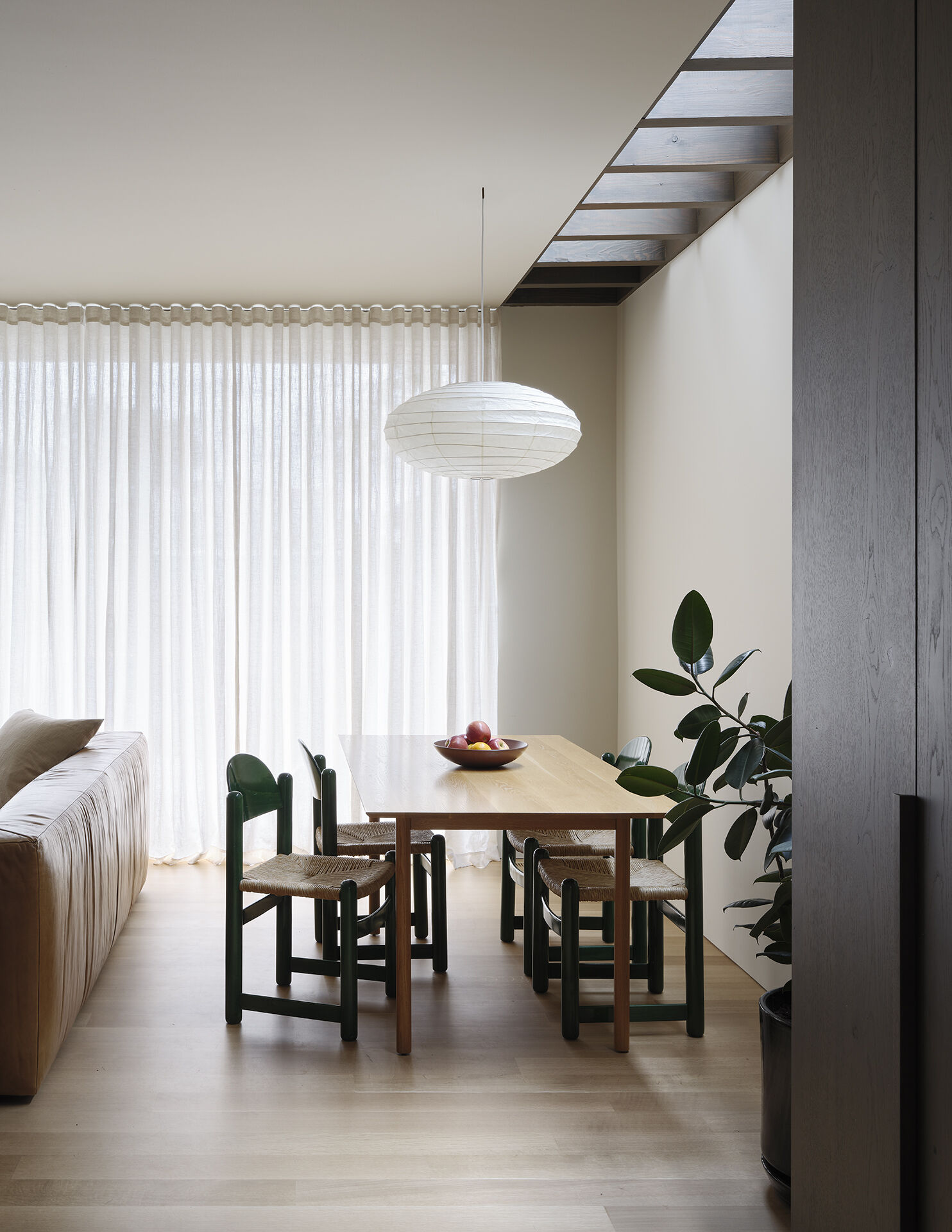 Skylights flood this dining area with soft daylight, creating an ever-changing atmosphere throughout the year.
