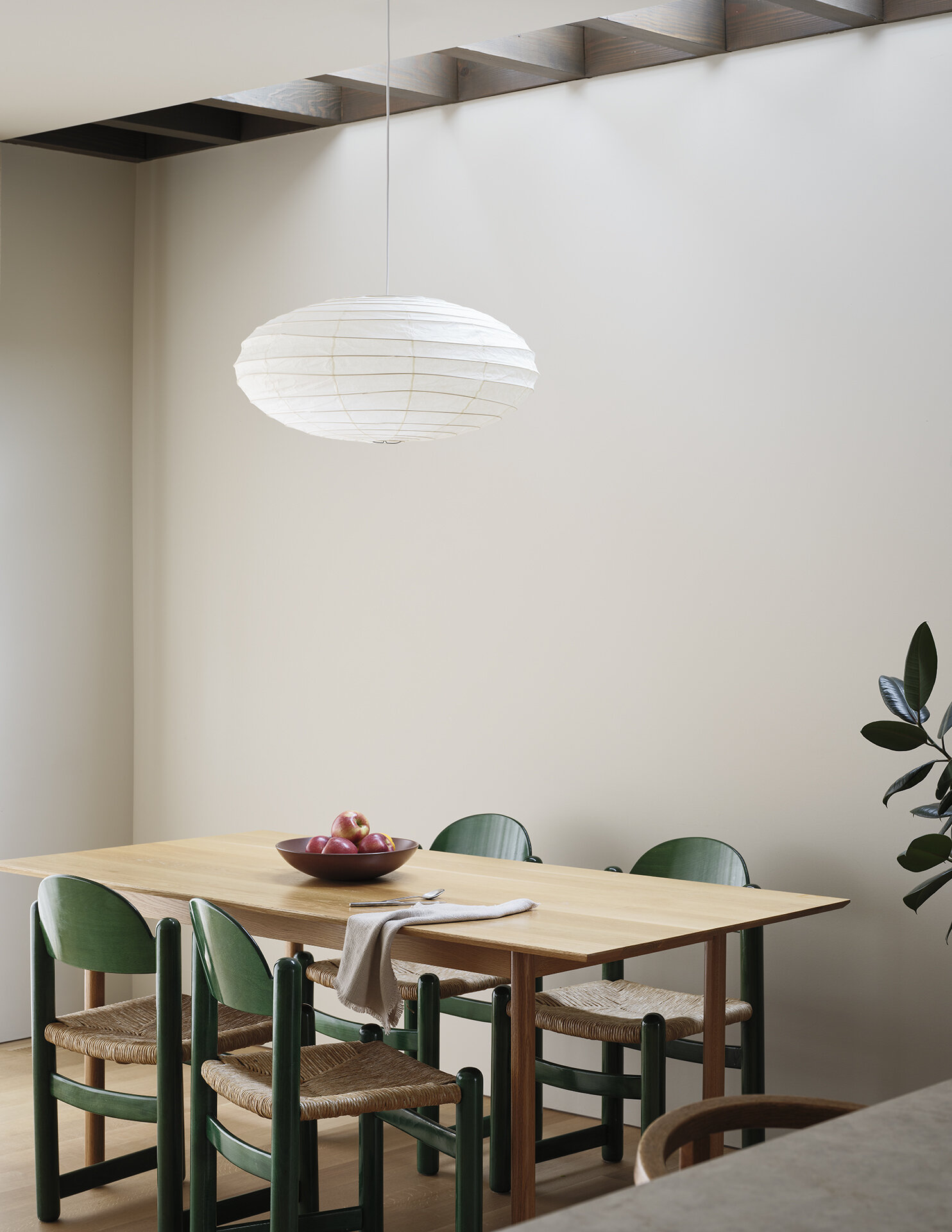 Skylights flood this dining area with soft daylight, creating an ever-changing atmosphere throughout the year.