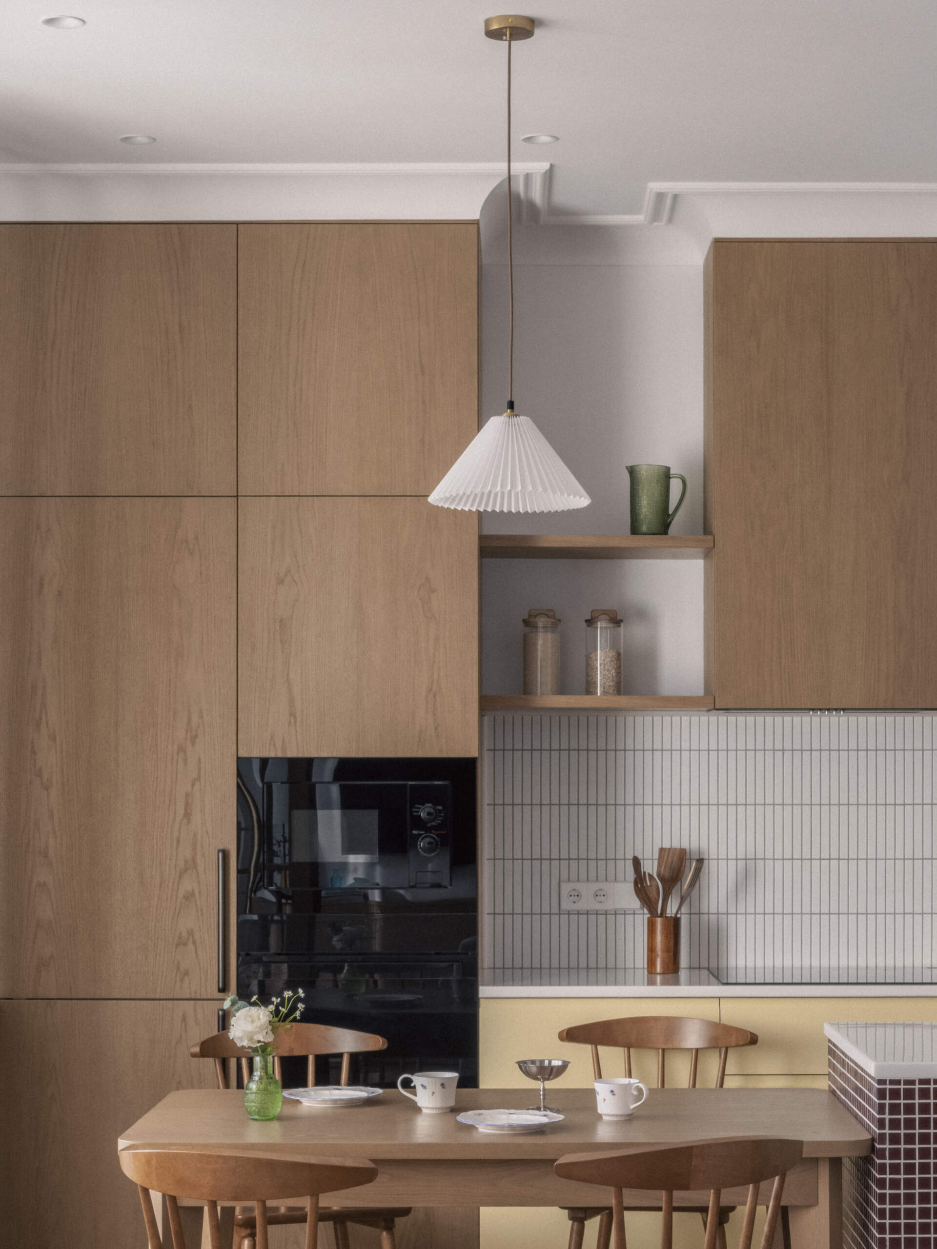 The dining and kitchen area balances practicality and warmth with subtle colors, open space, and a layout designed for everyday family life.