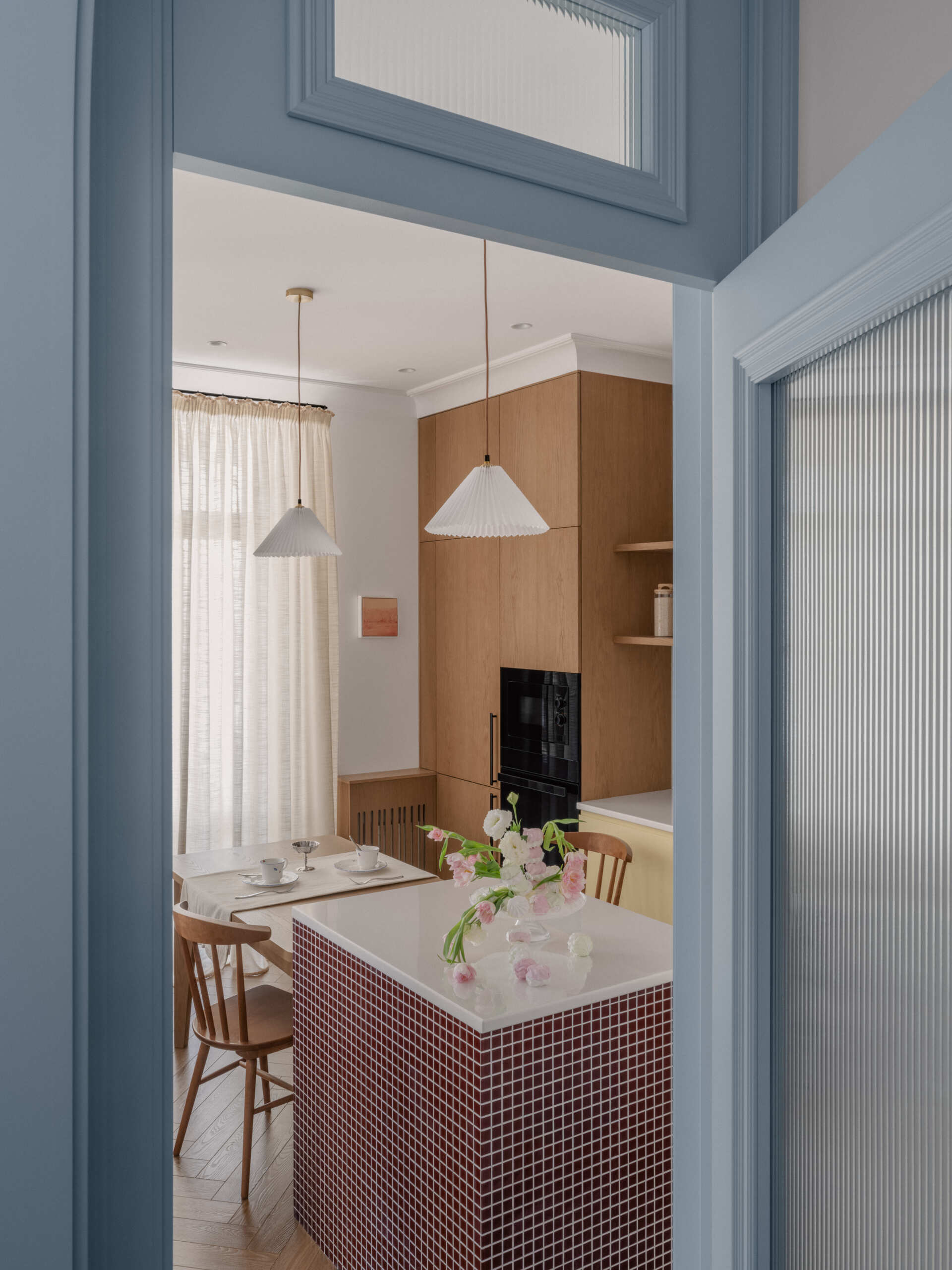 The dining and kitchen area balances practicality and warmth with subtle colors, open space, and a layout designed for everyday family life.