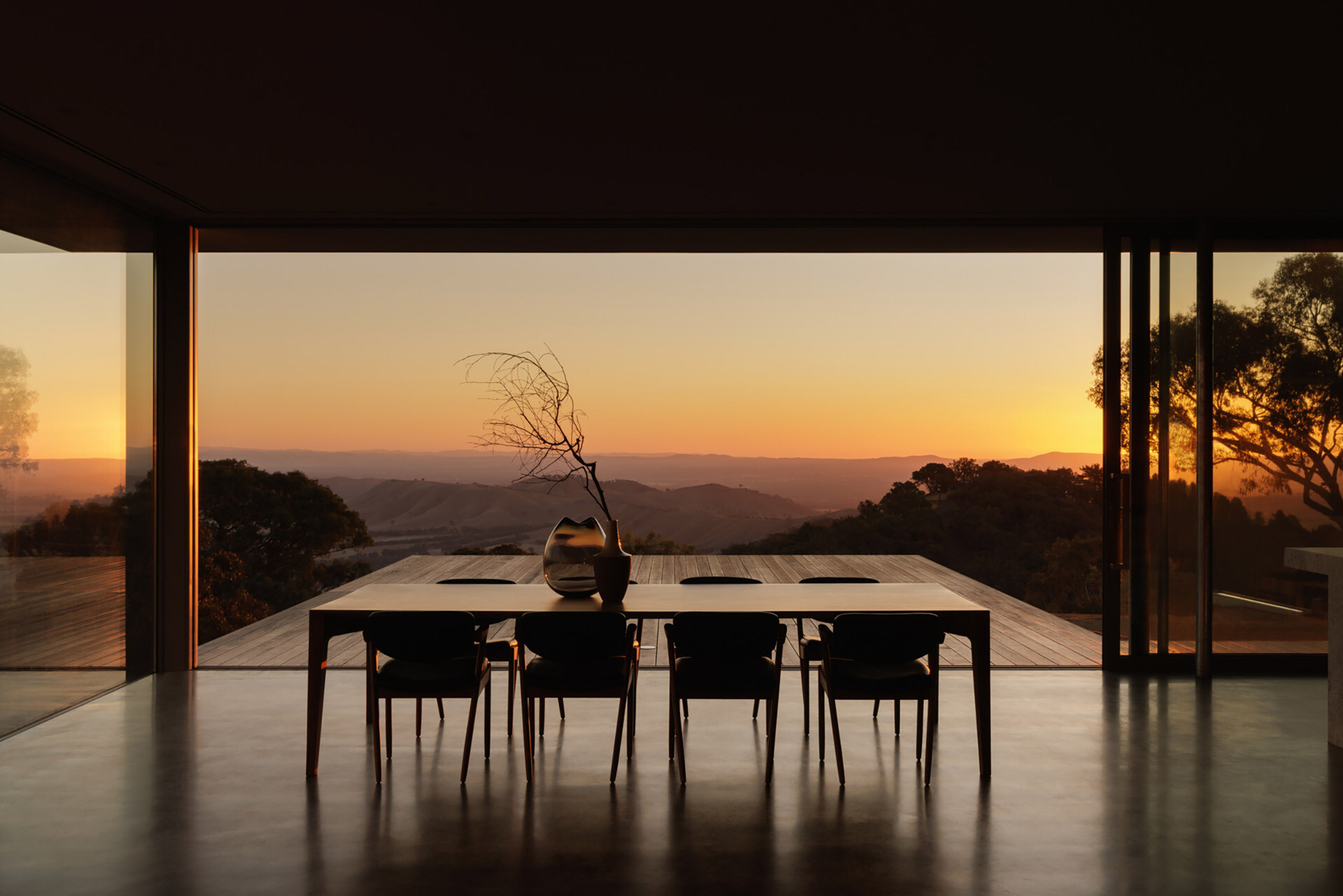 Positioned between the kitchen and outdoor entertaining spaces, the dining area enjoys uninterrupted views across the valleys.