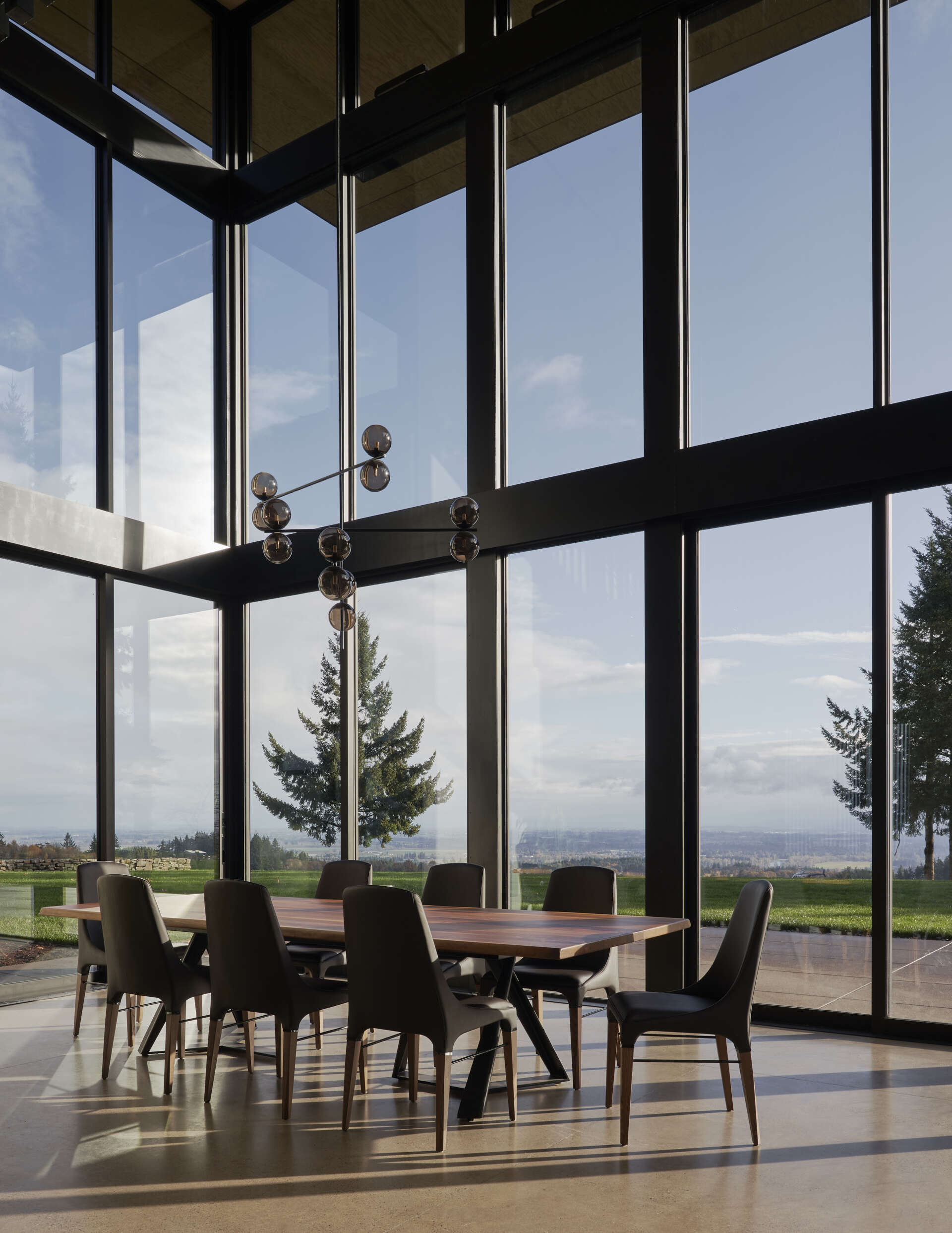 A modern dining room opens to a patio.