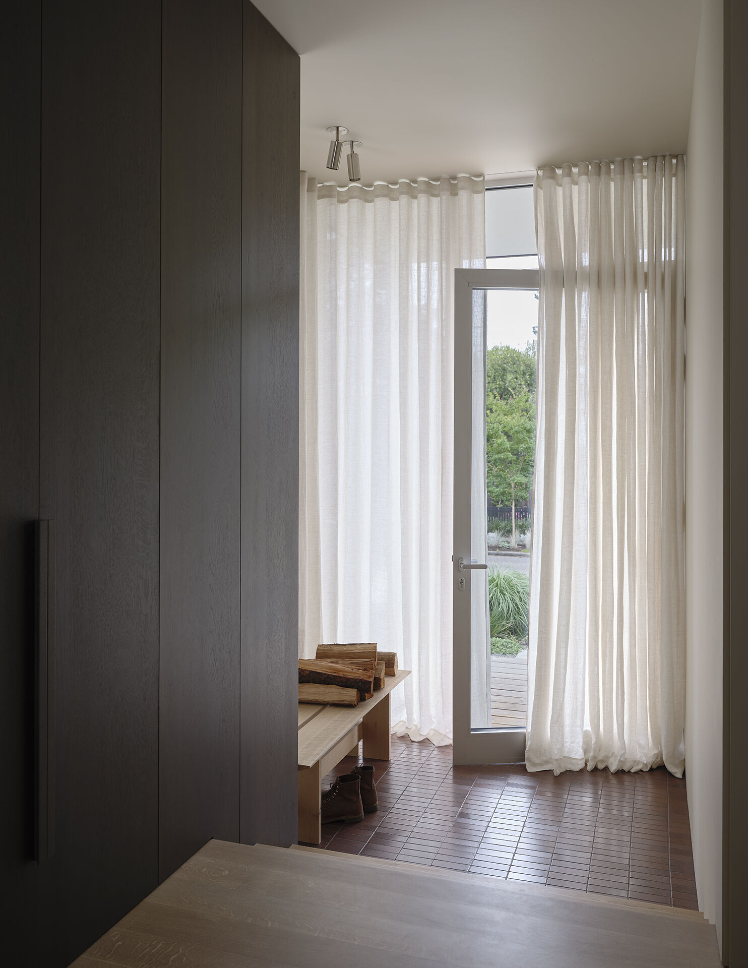 See how a tiled entryway and built-in bench create a practical and stylish first impression inside this Seattle bungalow.