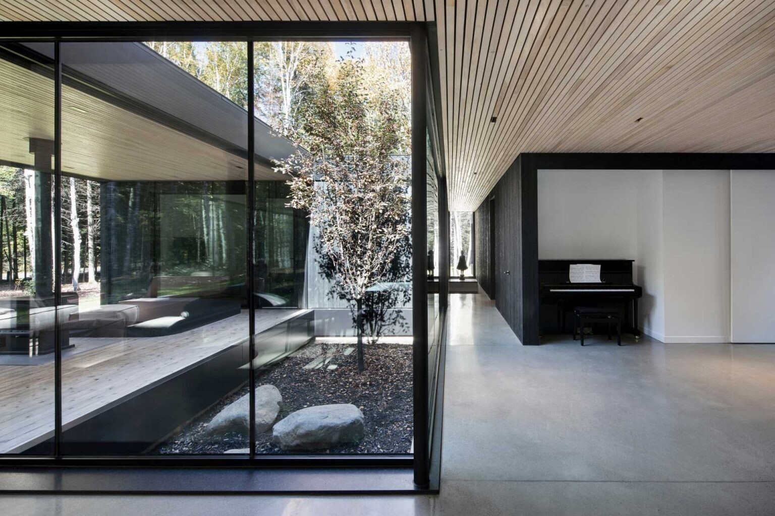 Hallways connect the main living areas with bedrooms and bathrooms, separating shared and private spaces while maintaining flow.