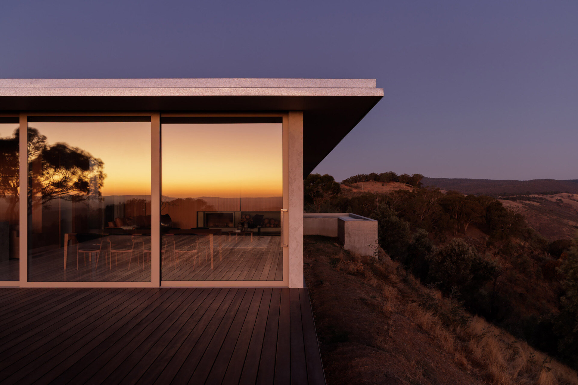 This elevated terrace projects into the landscape, offering panoramic views that stretch across the surrounding countryside and mountains.