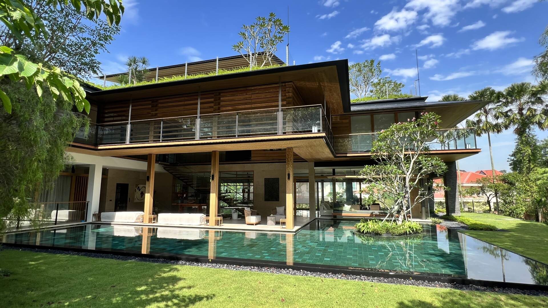 Sky Pavilion House by Guz Architects transforms an unusual Singapore site into a lush garden-focused home with a rooftop pavilion, glass staircase, swimming pool, and smart passive cooling features. Discover how greenery, natural breezes, and tropical design come together in this stunning residence.