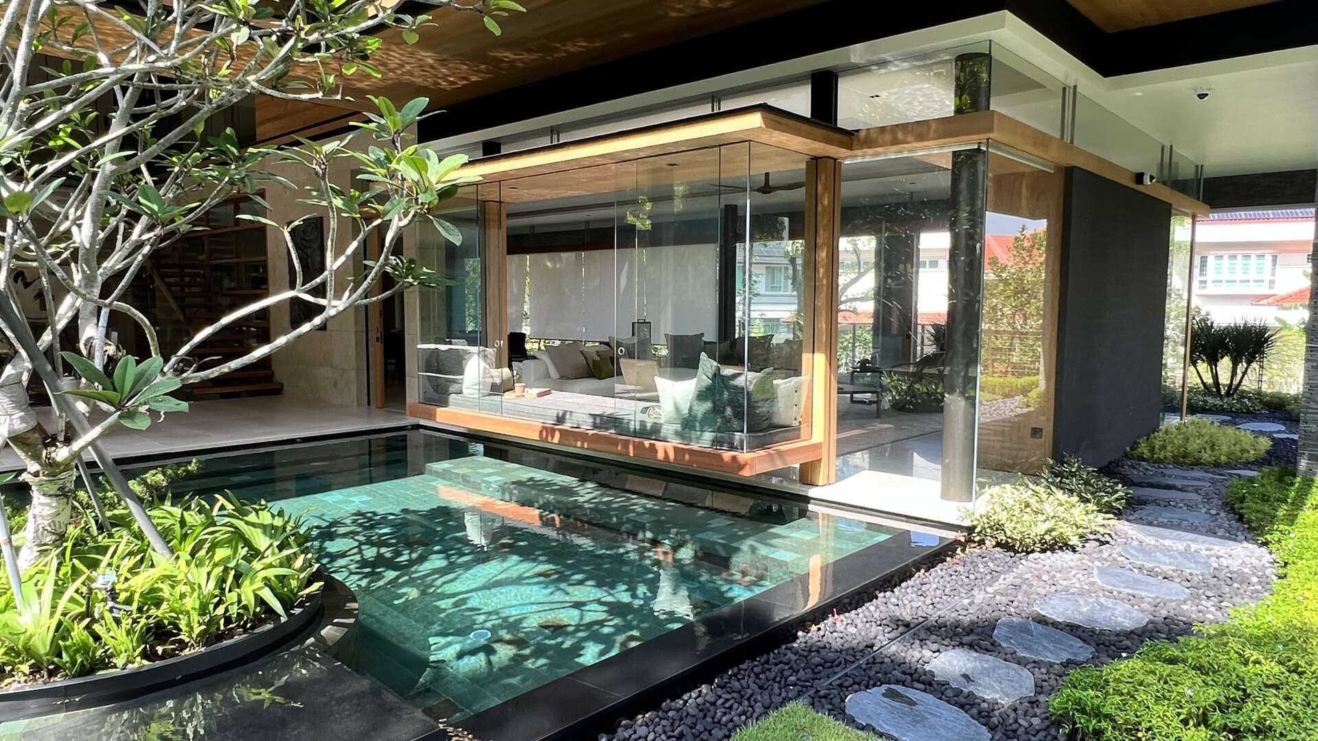 Sky Pavilion House by Guz Architects transforms an unusual Singapore site into a lush garden-focused home with a rooftop pavilion, glass staircase, swimming pool, and smart passive cooling features. Discover how greenery, natural breezes, and tropical design come together in this stunning residence.