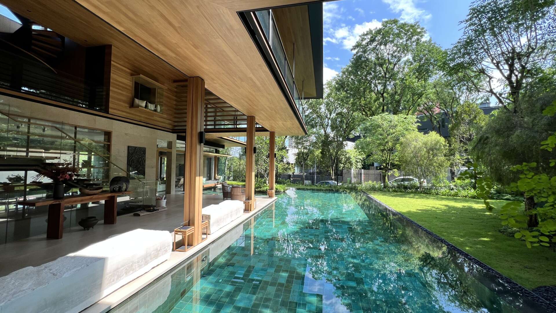 Sky Pavilion House by Guz Architects transforms an unusual Singapore site into a lush garden-focused home with a rooftop pavilion, glass staircase, swimming pool, and smart passive cooling features. Discover how greenery, natural breezes, and tropical design come together in this stunning residence.