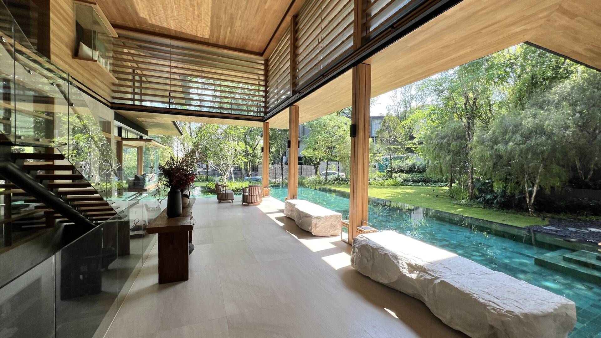 Sky Pavilion House by Guz Architects transforms an unusual Singapore site into a lush garden-focused home with a rooftop pavilion, glass staircase, swimming pool, and smart passive cooling features. Discover how greenery, natural breezes, and tropical design come together in this stunning residence.