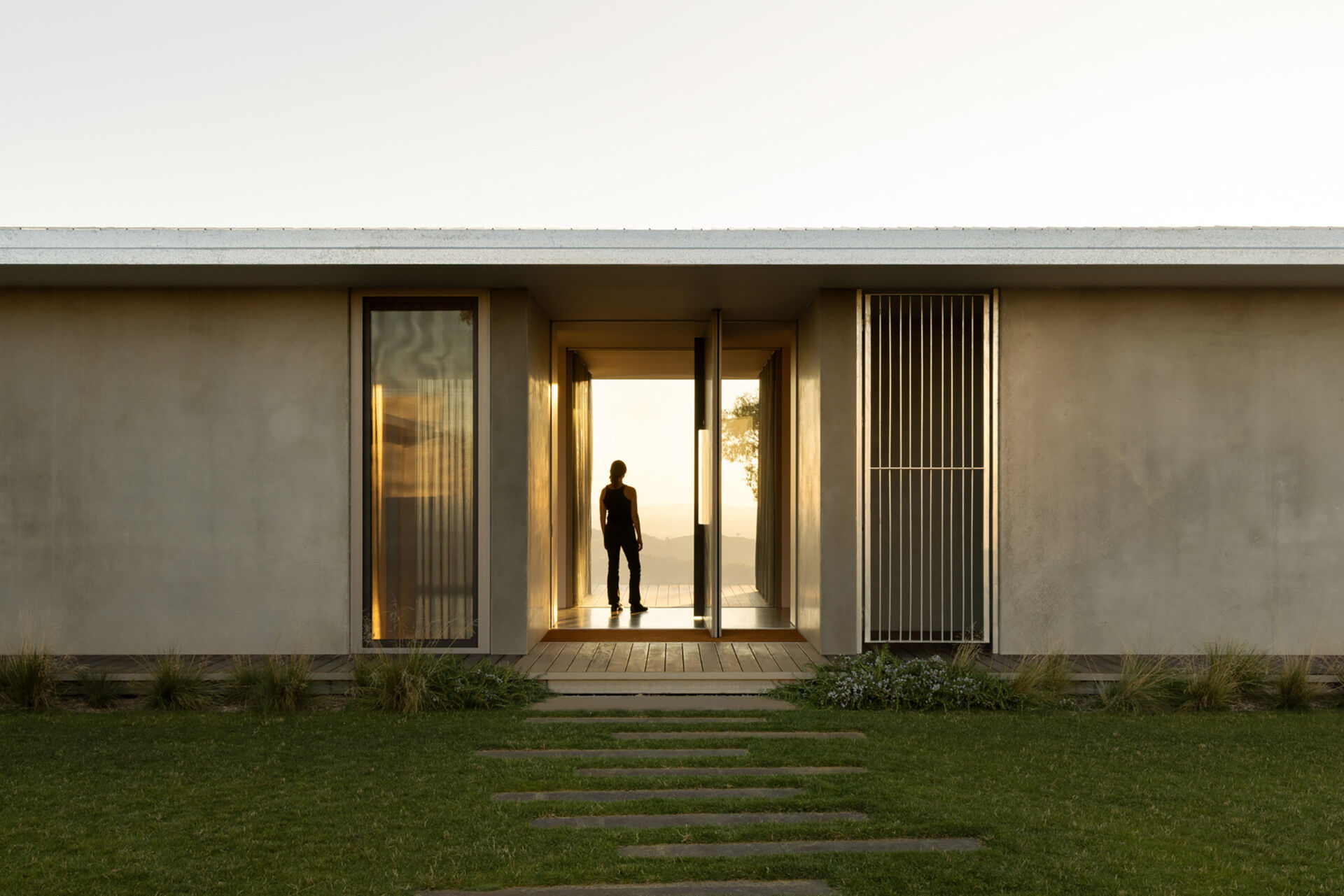 The transition from sheltered courtyard to expansive valley views creates a memorable entry sequence filled with contrast and discovery.