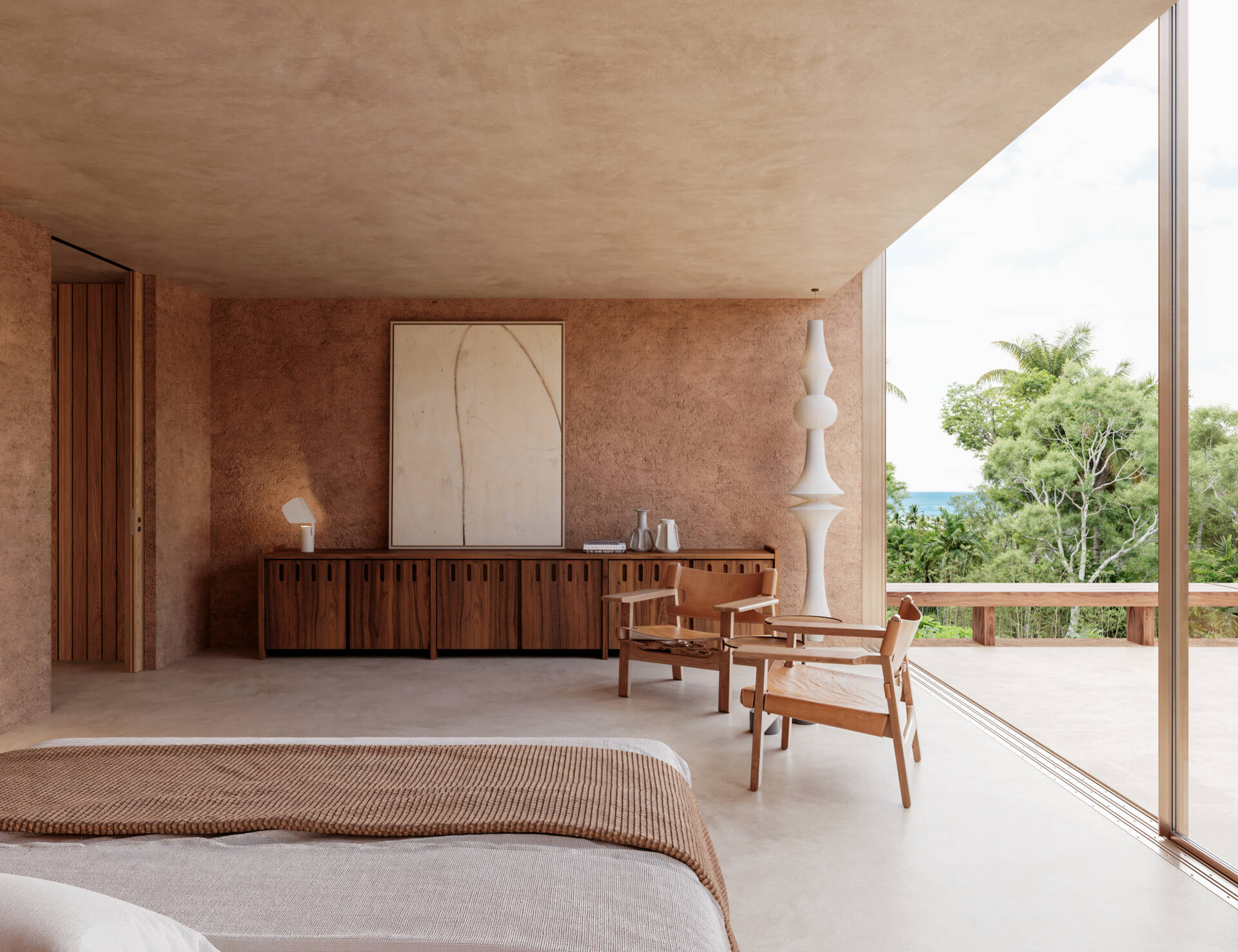 A modern bedroom with a sliding door that opens to an outdoor space.