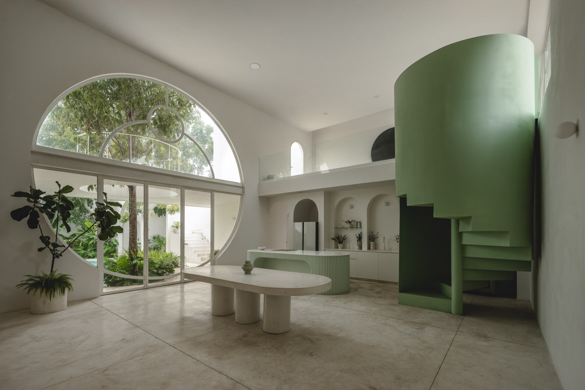 Eclipse House in Mérida, Mexico, is a striking exploration of geometry, light, and landscape. Designed by Etea and Ghostframe, the home features a dramatic double-height gallery, arch-lined walkways, circular openings that inspired its name, and lush gardens woven throughout the architecture.
