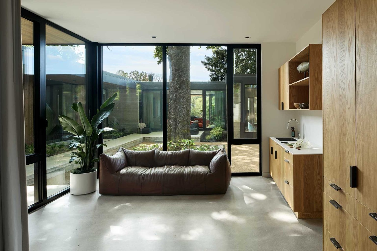 Discover flexible living spaces, including a cozy sitting room and detached guest house designed for visiting family and friends.