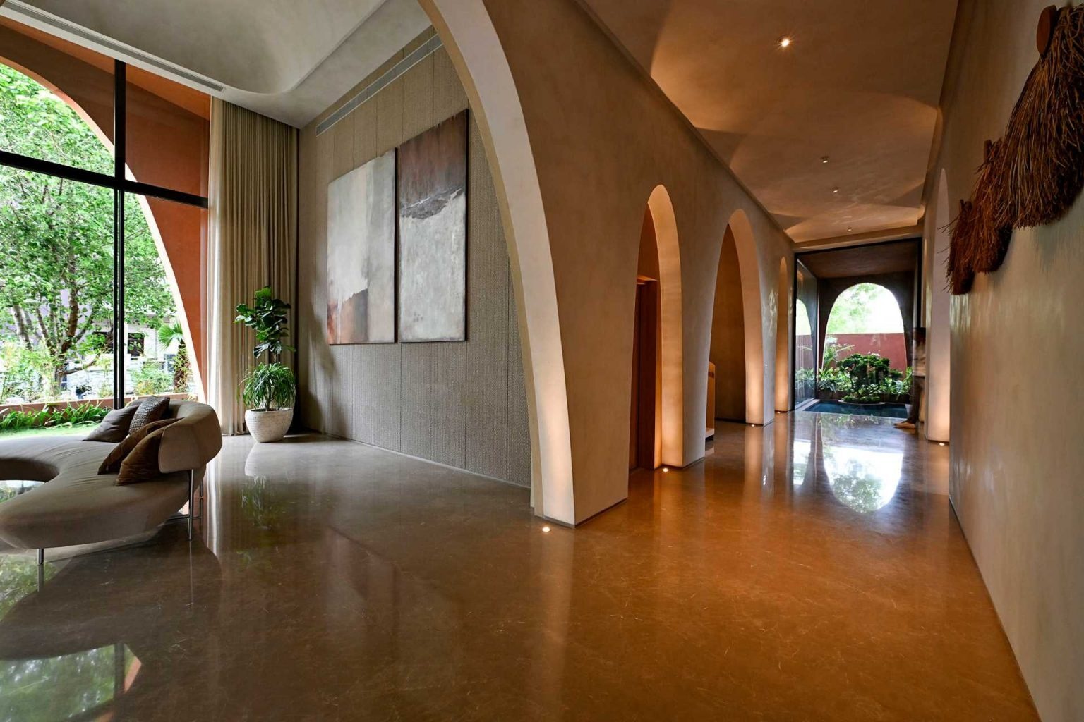 Arches continue indoors, shaping living spaces, framing views, and creating beautiful transitions that bring warmth and character to the home.