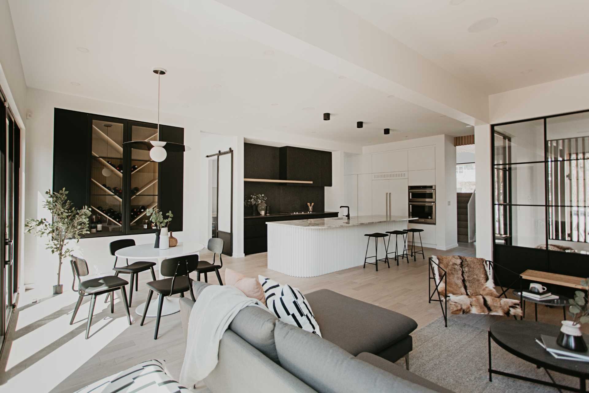 Tour this stunning Edmonton home by NAKO Design, where Japandi style meets Australian influence through warm wood, bold black accents, and beautifully balanced modern interiors.