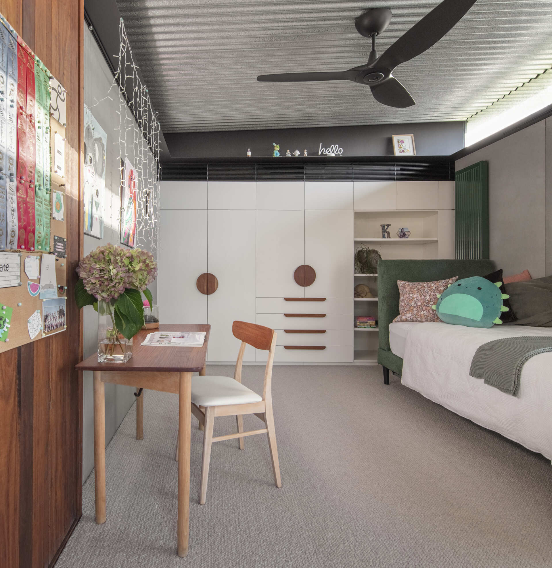 Light-filled children's bedrooms connect to gallery spaces, study areas, and playful family features throughout the upper level.