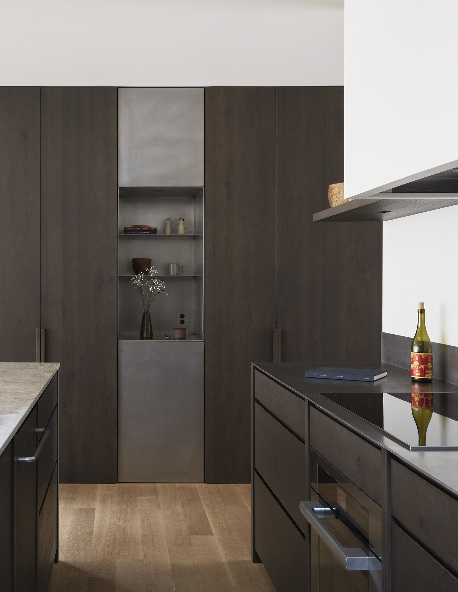 Dark wood cabinets and light countertops create a striking contrast in this modern Seattle kitchen.