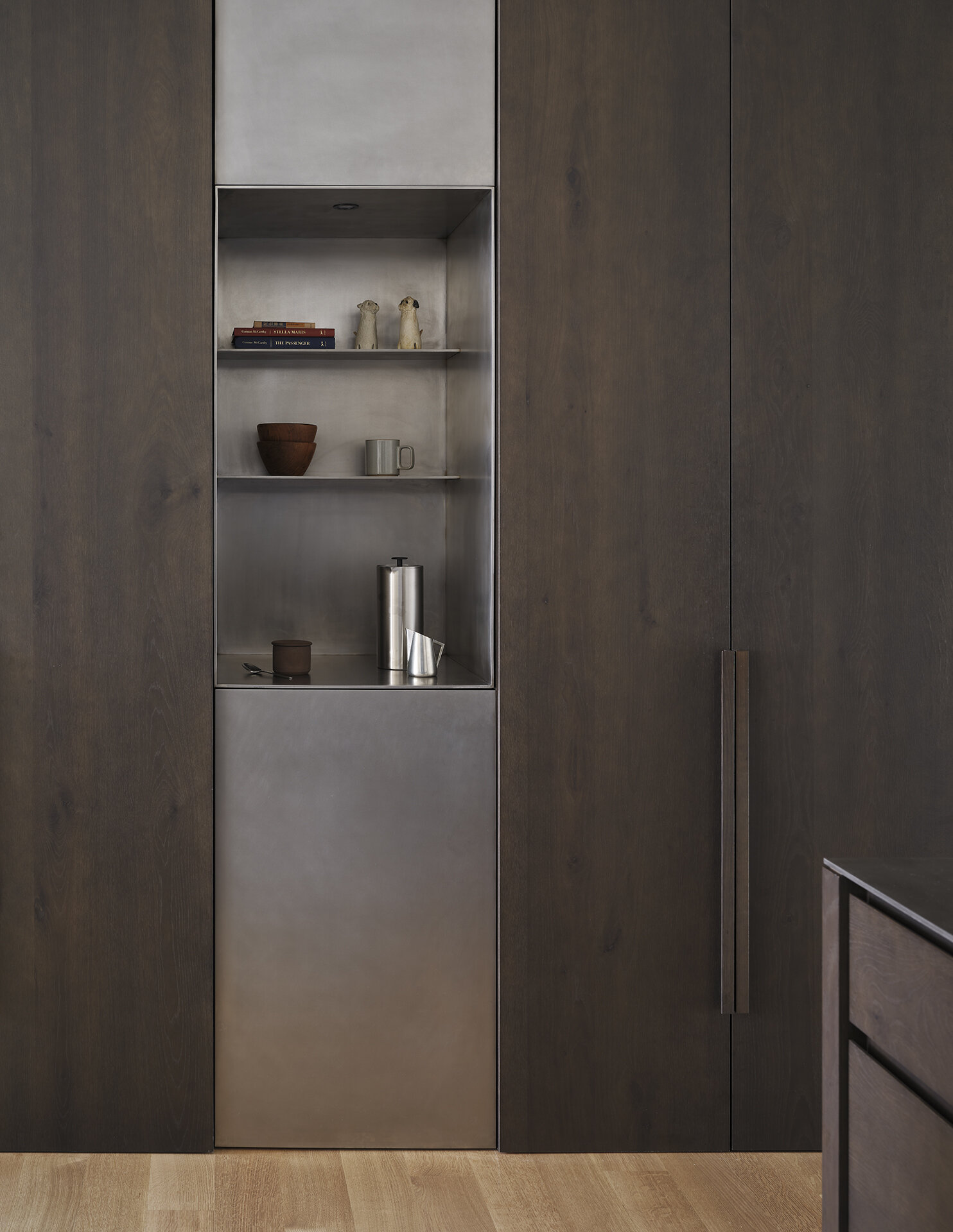 Dark wood cabinets and light countertops create a striking contrast in this modern Seattle kitchen.