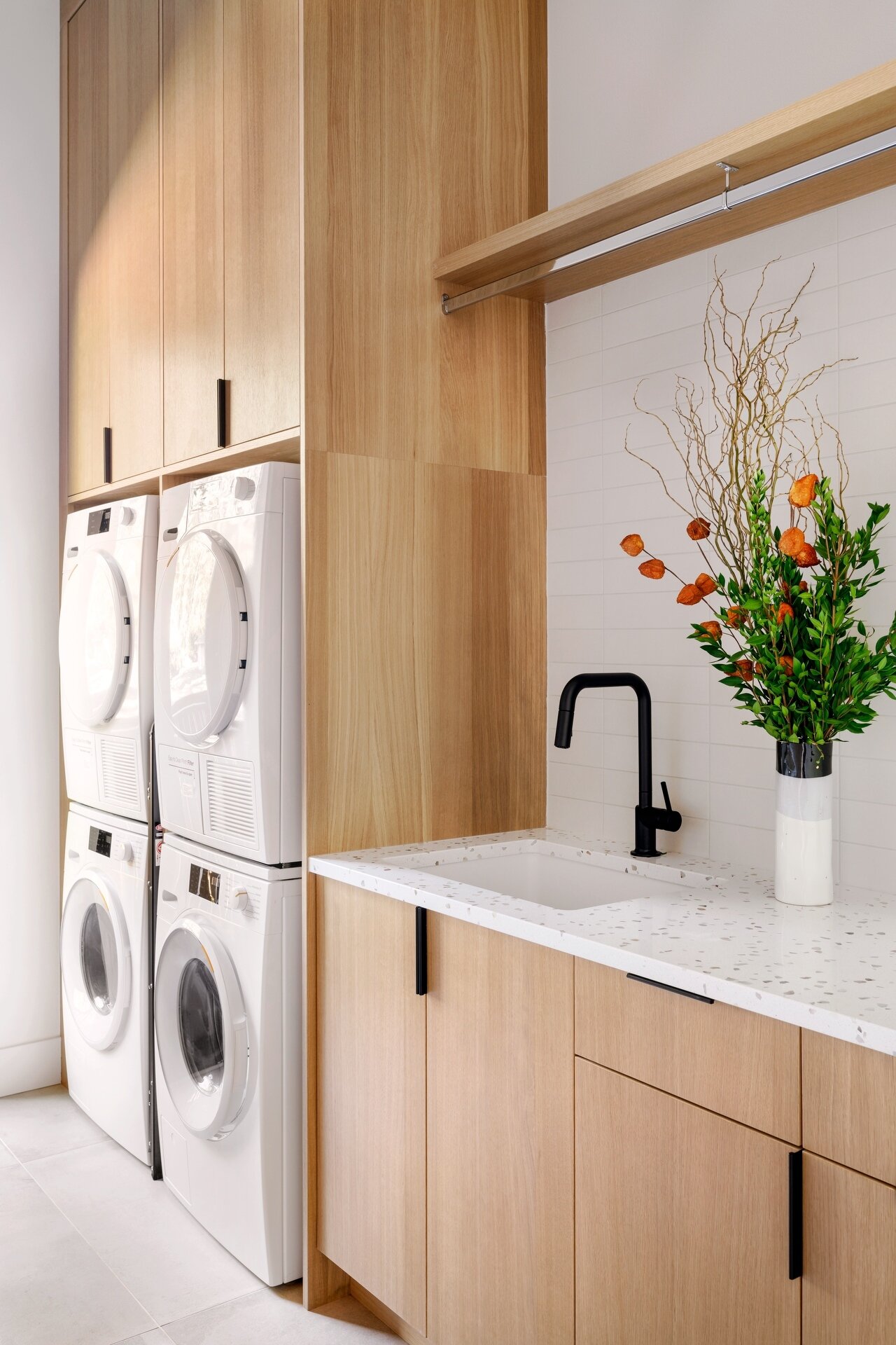 Take a look inside this stylish modern laundry room with warm timber cabinetry, practical storage, and fresh contemporary finishes.