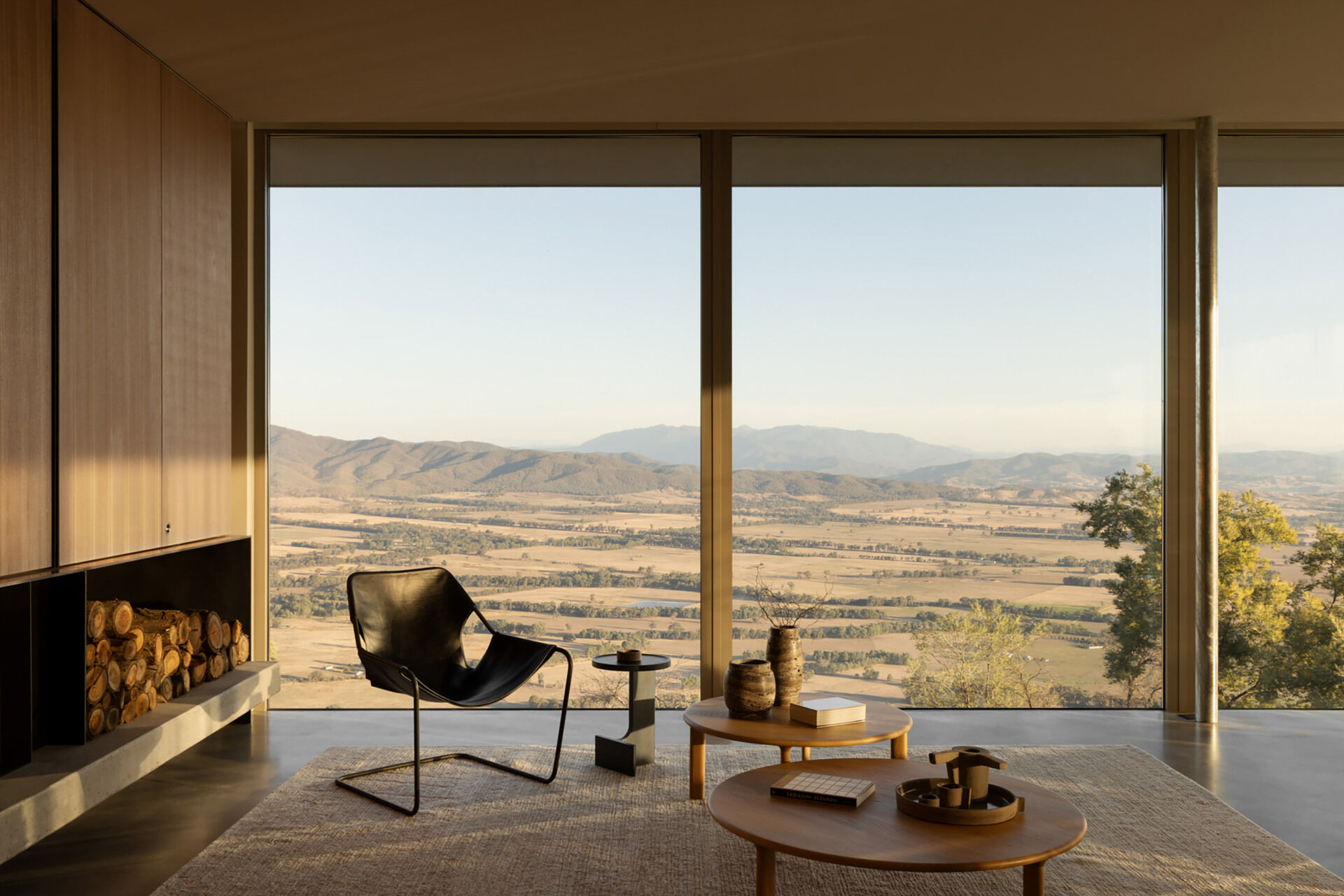 Floor-to-ceiling glazing and open-plan living spaces make the surrounding Victorian landscape a constant feature of everyday life.