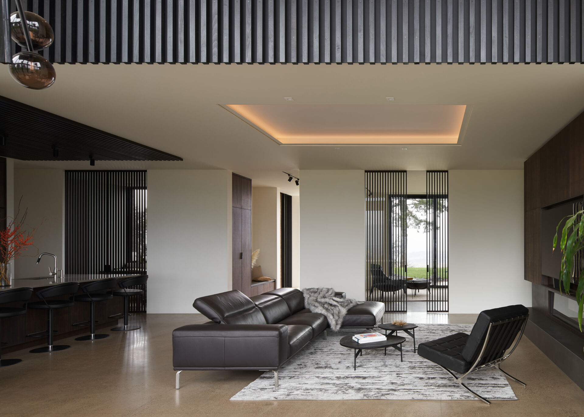 A modern open plan living room and kitchen.