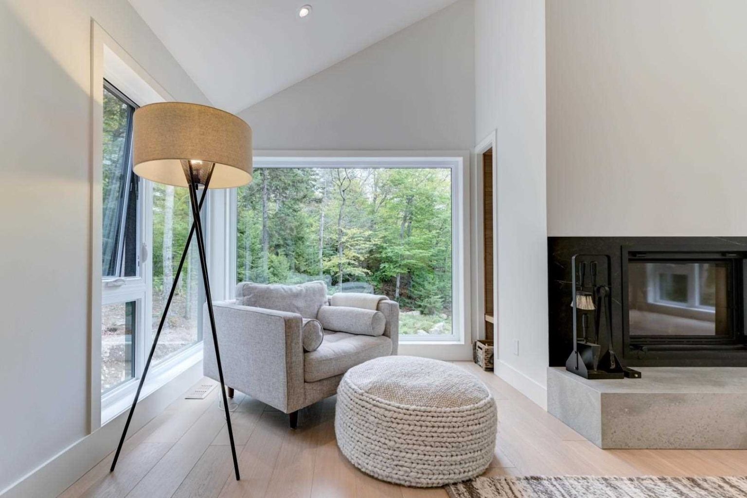 This cozy sitting area combines garden views, natural light, and minimalist styling for a relaxing place to unwind.