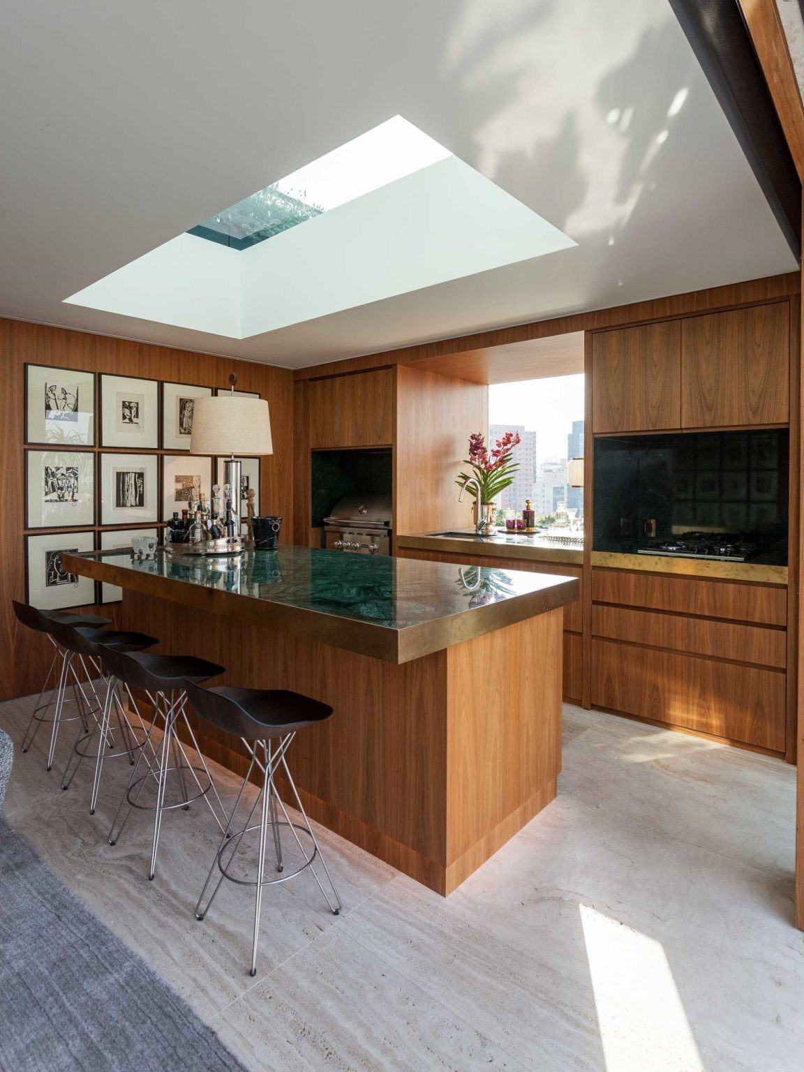 This luxury penthouse terrace combines a pool, lounge, outdoor dining, and panoramic city views. Connected to an entertainment room with a fireplace and bar, it's designed for effortless indoor-outdoor living.