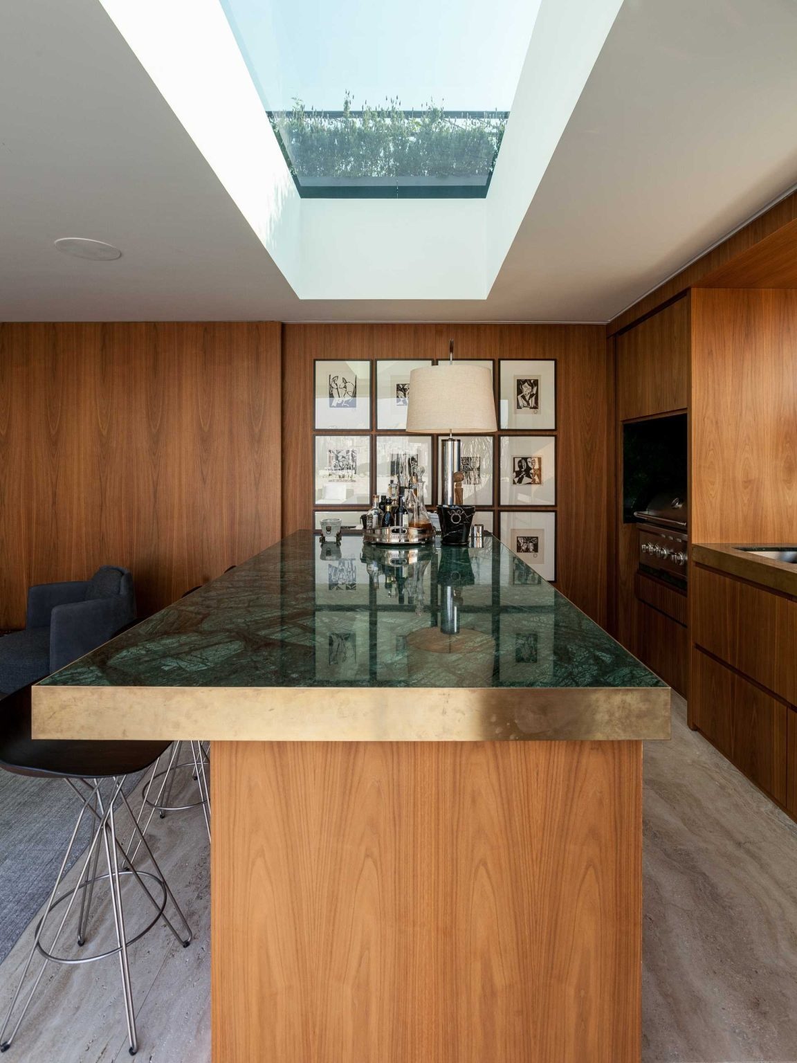 This luxury penthouse terrace combines a pool, lounge, outdoor dining, and panoramic city views. Connected to an entertainment room with a fireplace and bar, it's designed for effortless indoor-outdoor living.