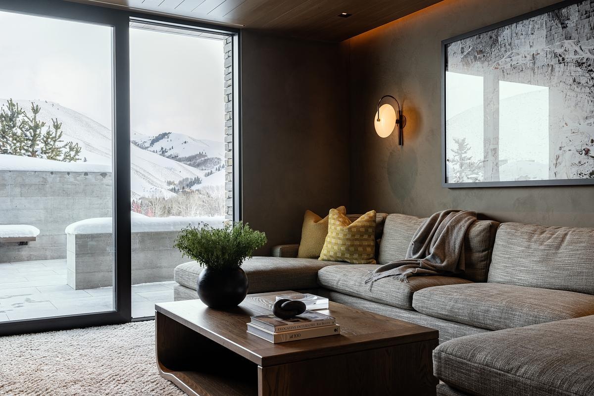 Hidden within the lower level, the media room offers a cozy and private entertainment space, surrounded by the shelter and quiet of the hillside setting.