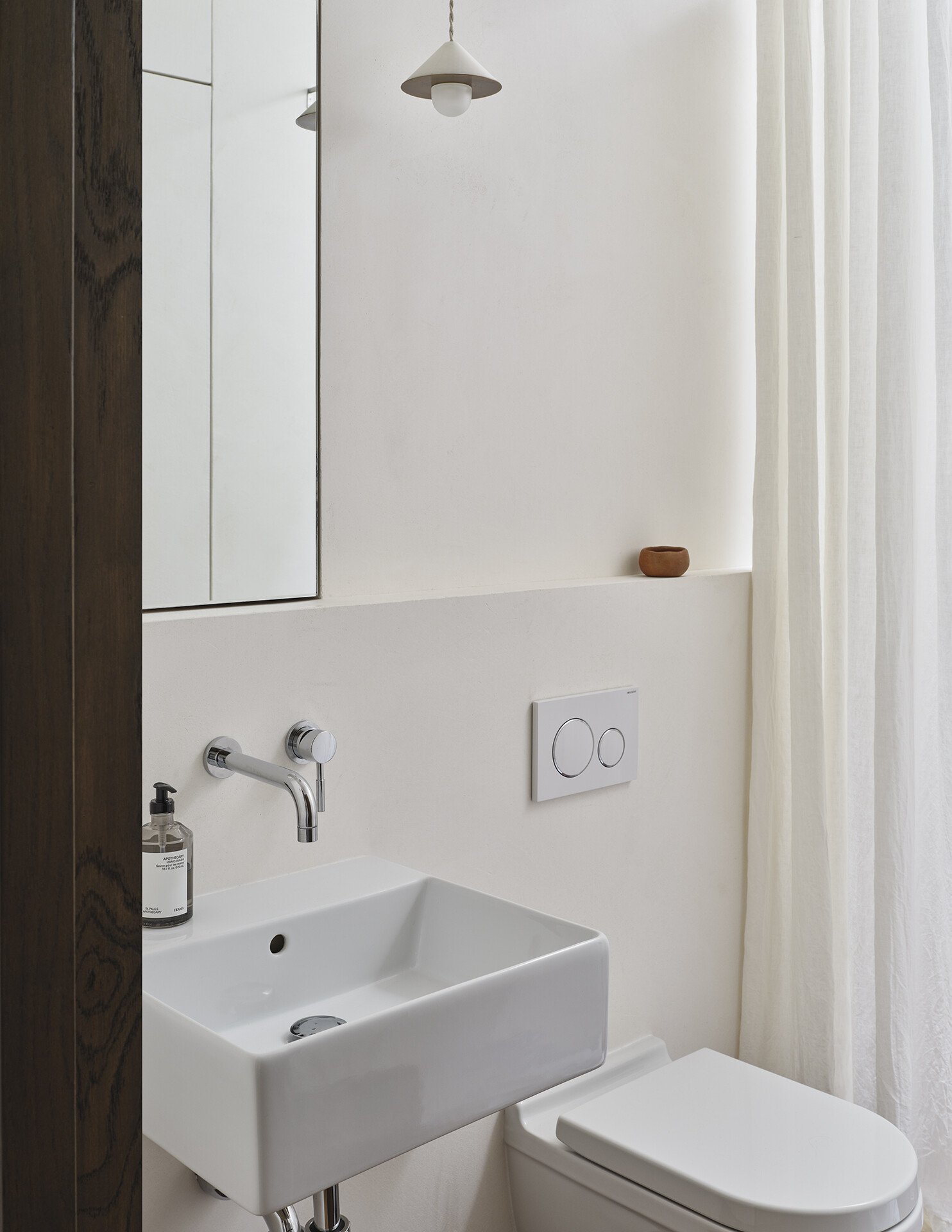 A skylight above the shower transforms this bathroom with bright natural light from above.