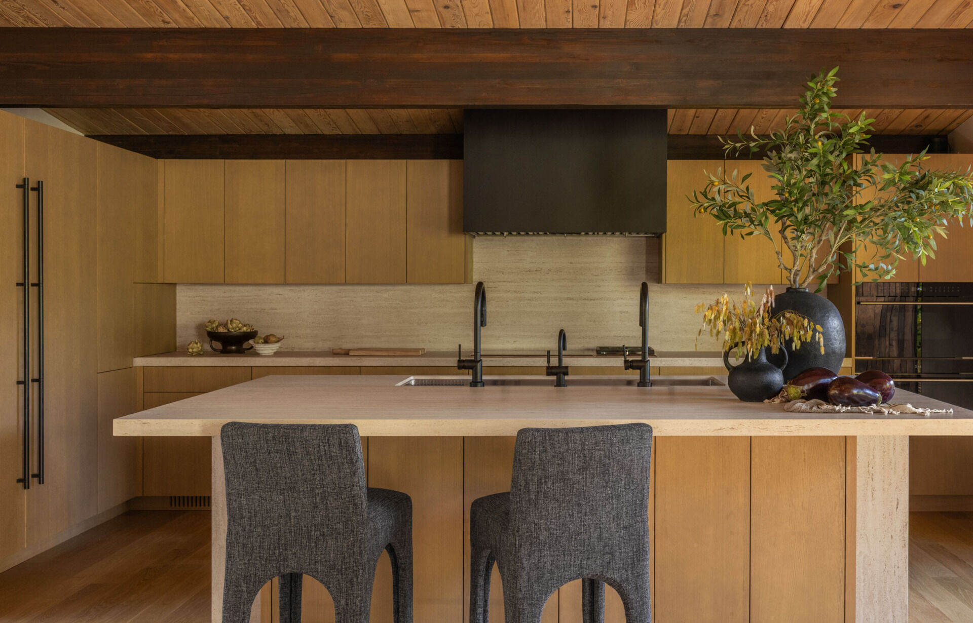 See how Island Crest's open kitchen, dining area, and expanded deck create flexible spaces for entertaining. White oak finishes, Dekton countertops, and an 18-foot sliding glass door blur the line between indoors and out.