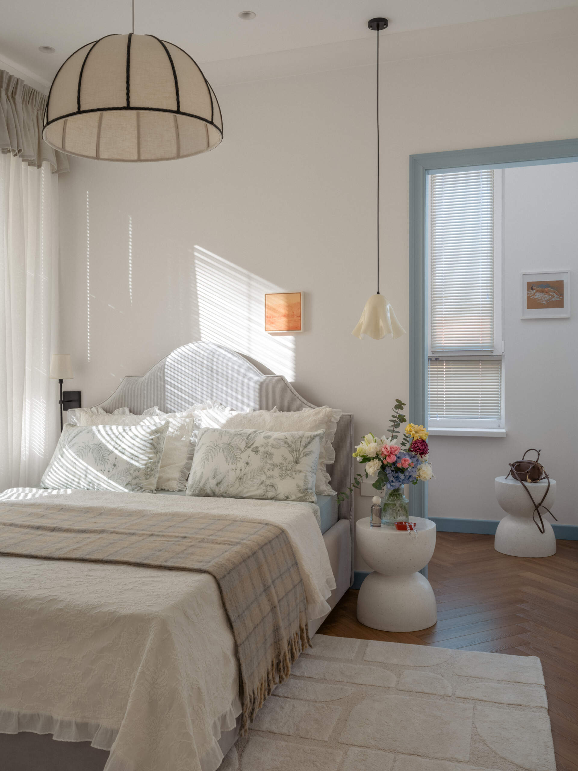A calming bedroom designed with soft colors and natural light creates a peaceful space for rest and relaxation.